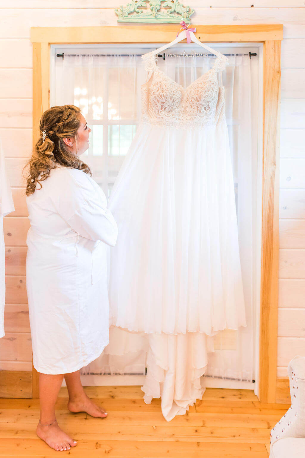 bride looking at her wedding dress
