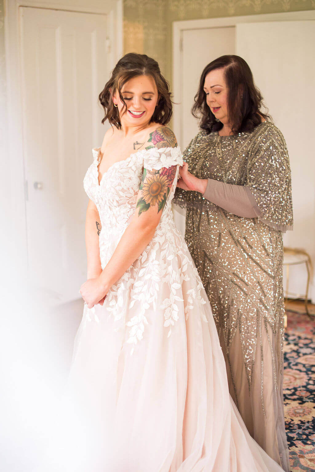 Mother of the Bride Zipping Up Daughters wedding dress