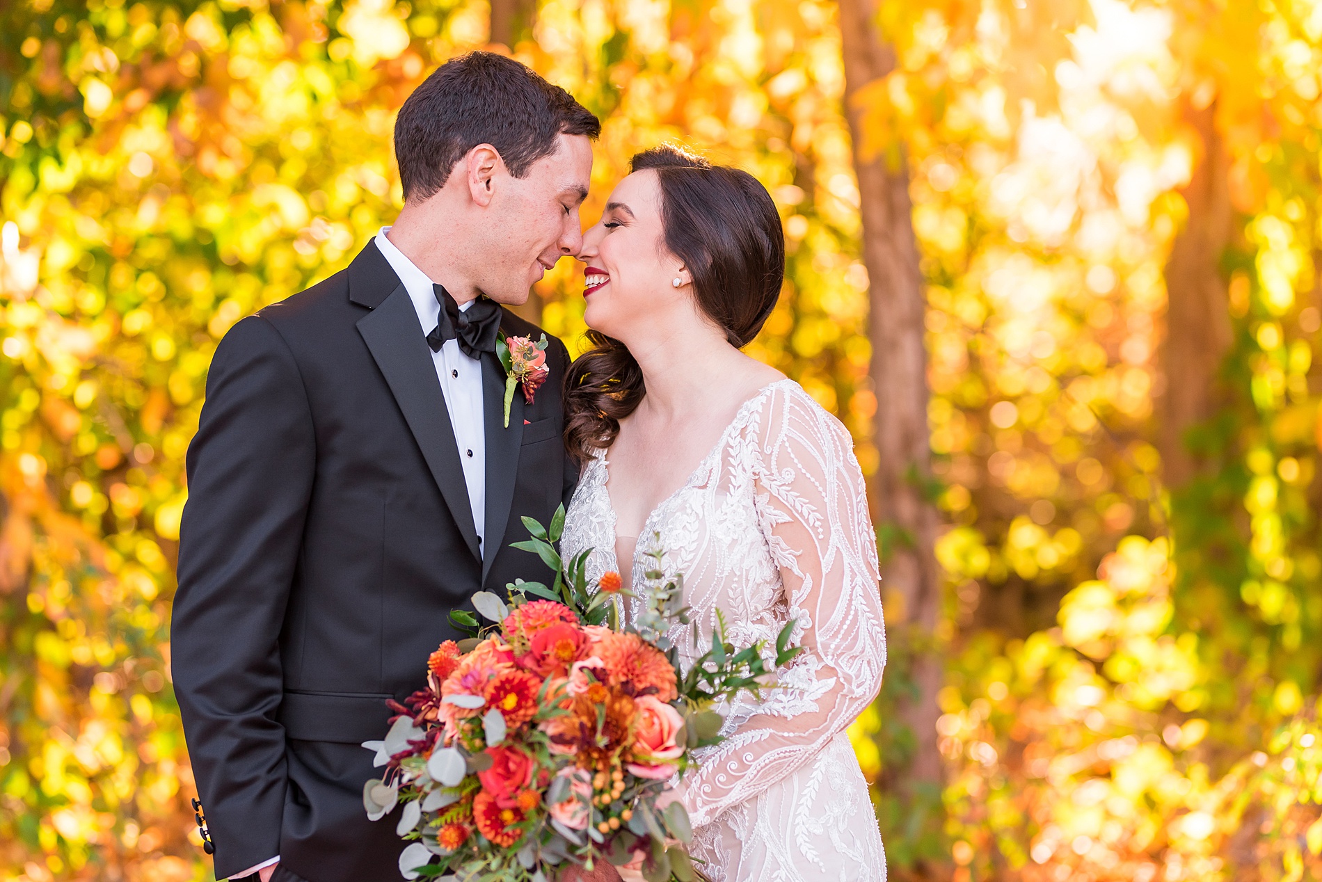 couple lean in for a kiss during bride and groom portraits