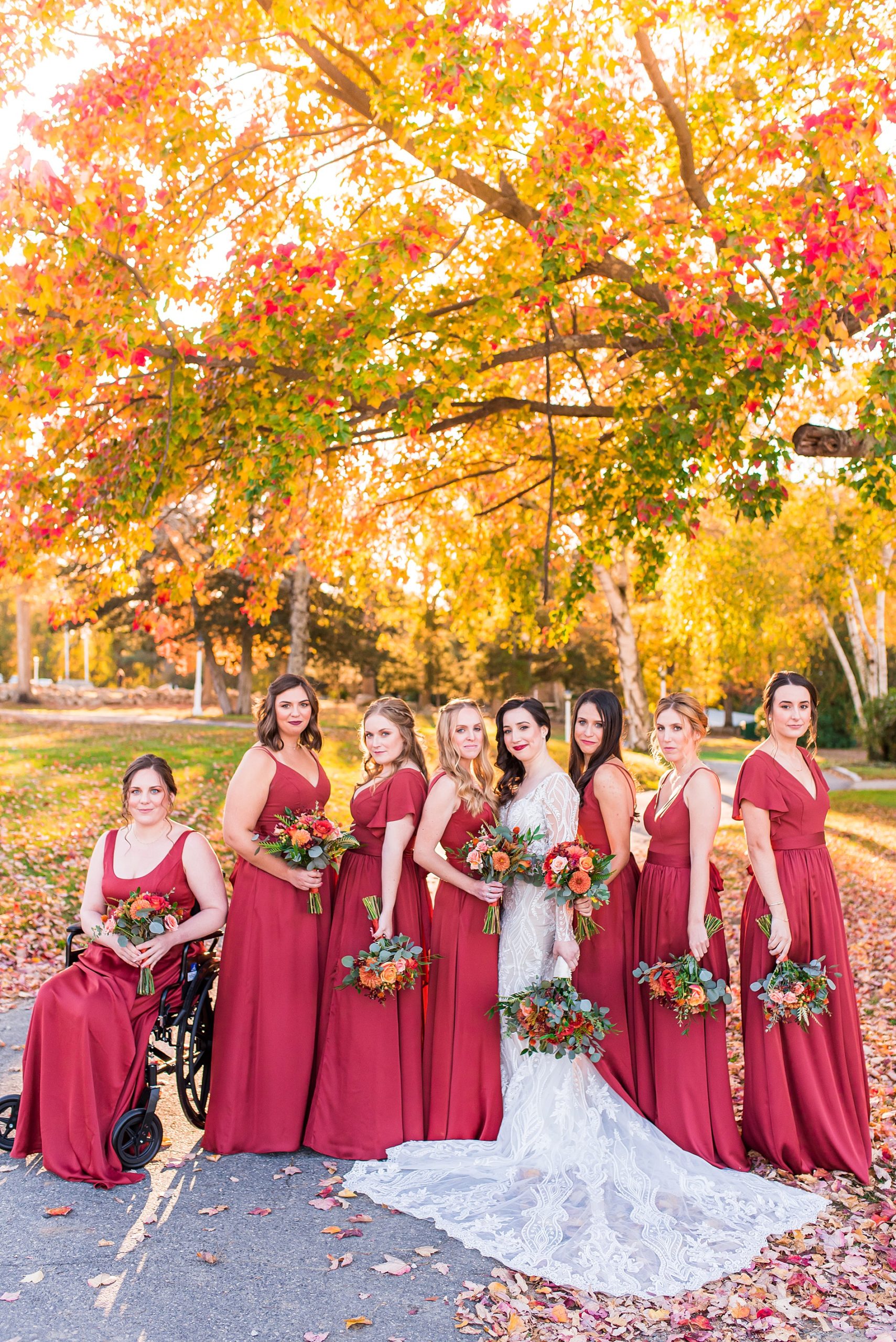 bride and bridesmaids in long red dresses