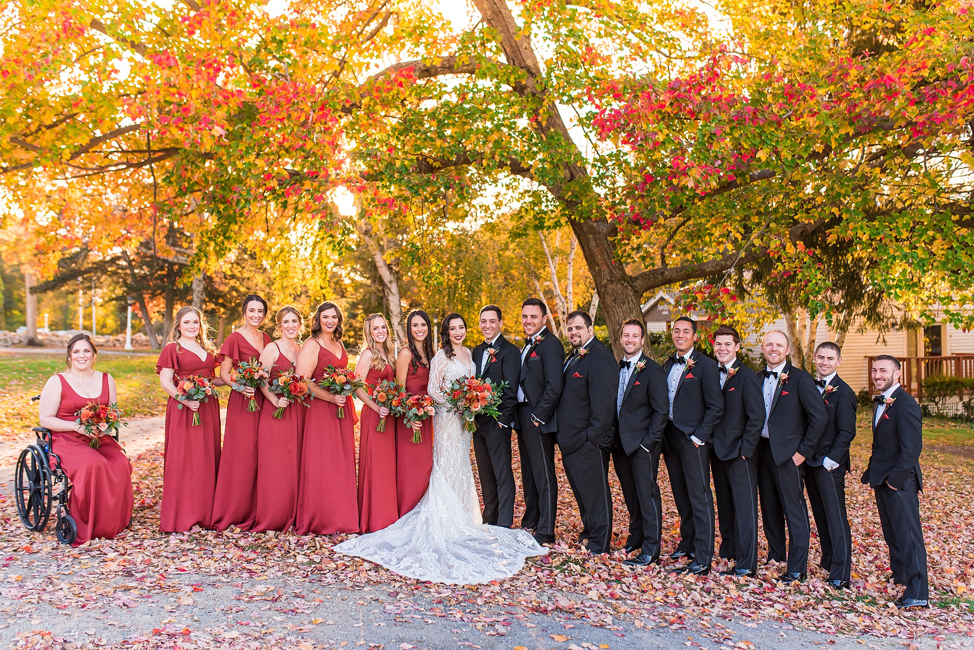 Ma bridal party under a canopy of trees