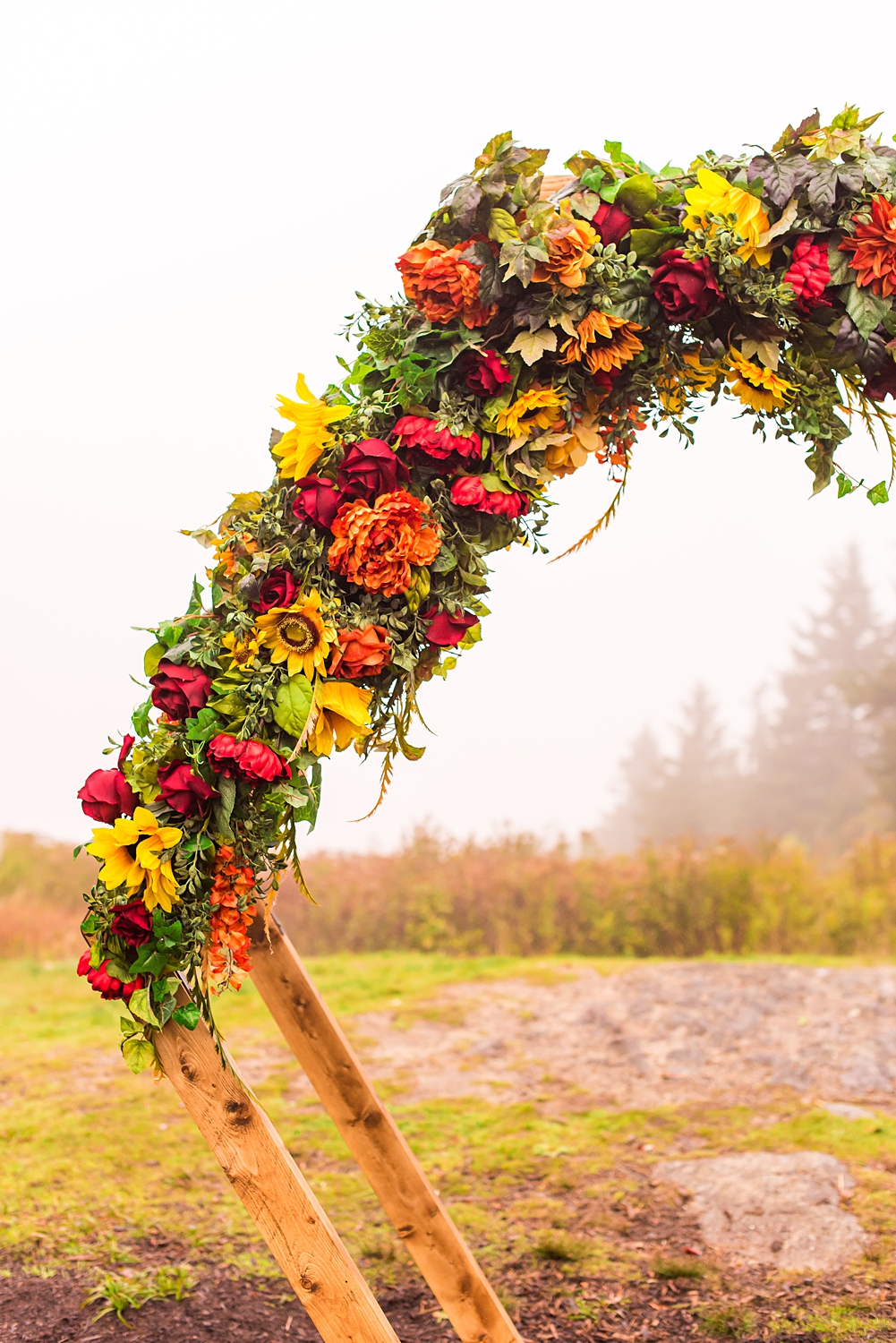 hexagon arch decorated with fall flowers for NH wedding at Mount Sunapee Resort