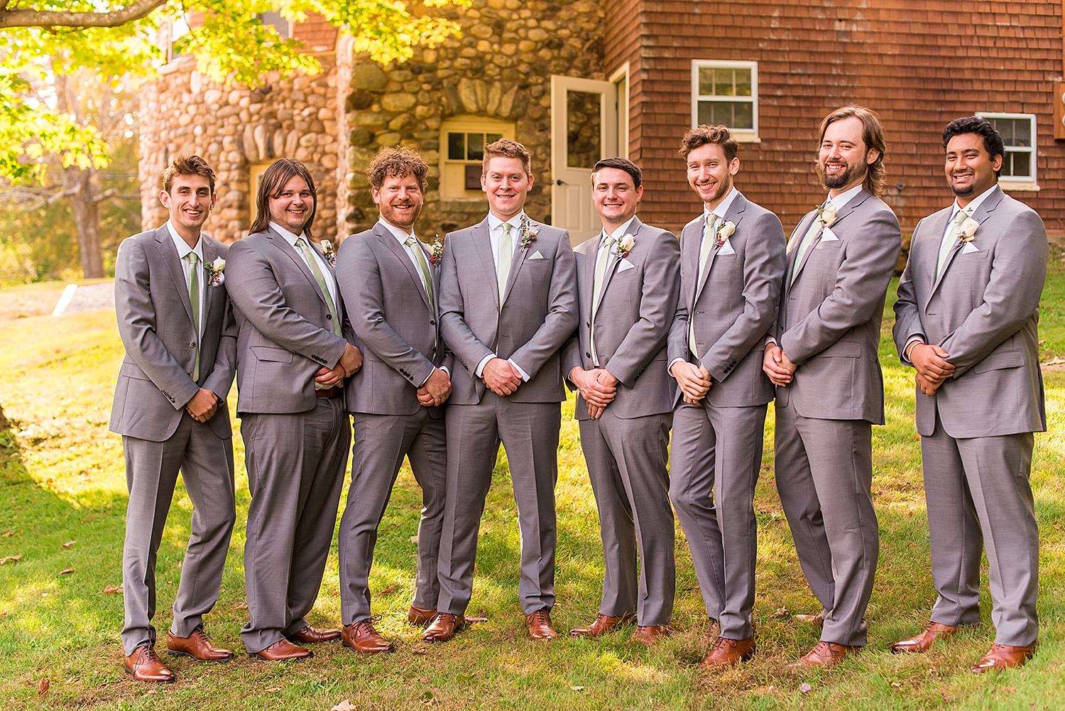 Groom and Groomsmen stand together before wedding ceremony in NH