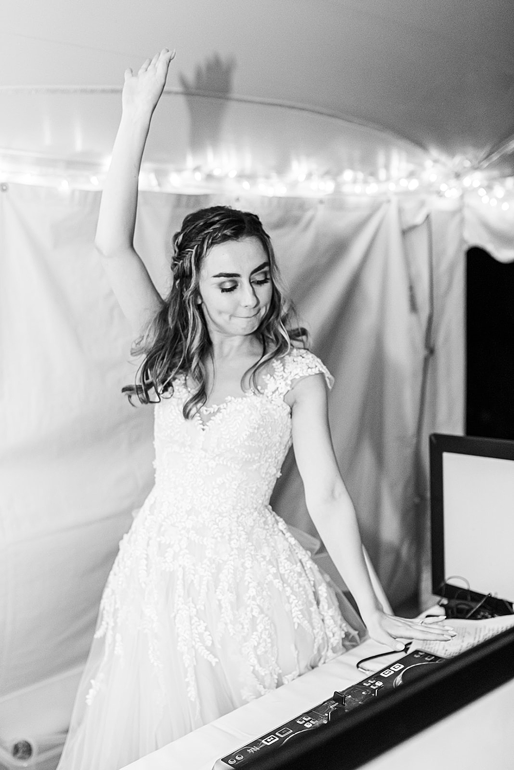 bride on the DJ records during her wedding reception