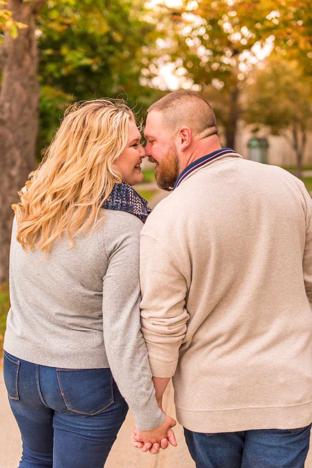 New Hampshire couple lean in together during fall engagement photos