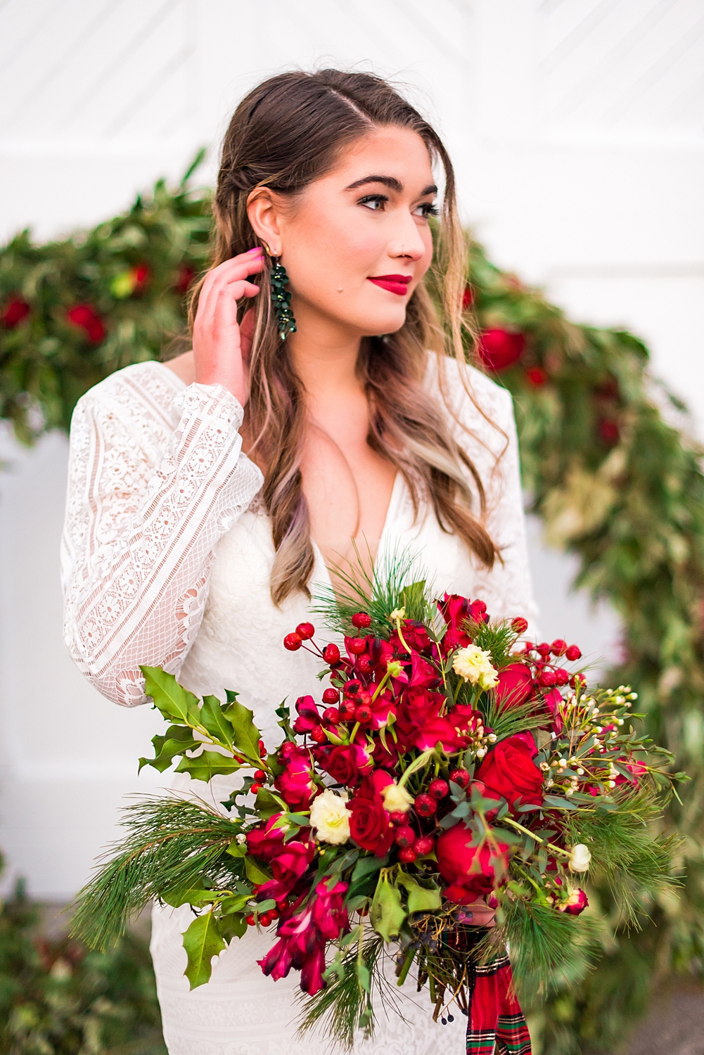 Bride during Winter Styled Shoot holding red bouquet
