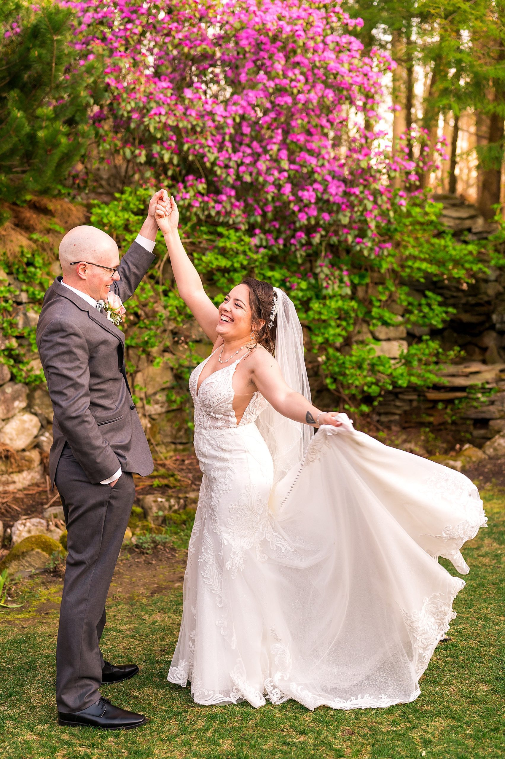 newlyweds dance and have fun during portraits