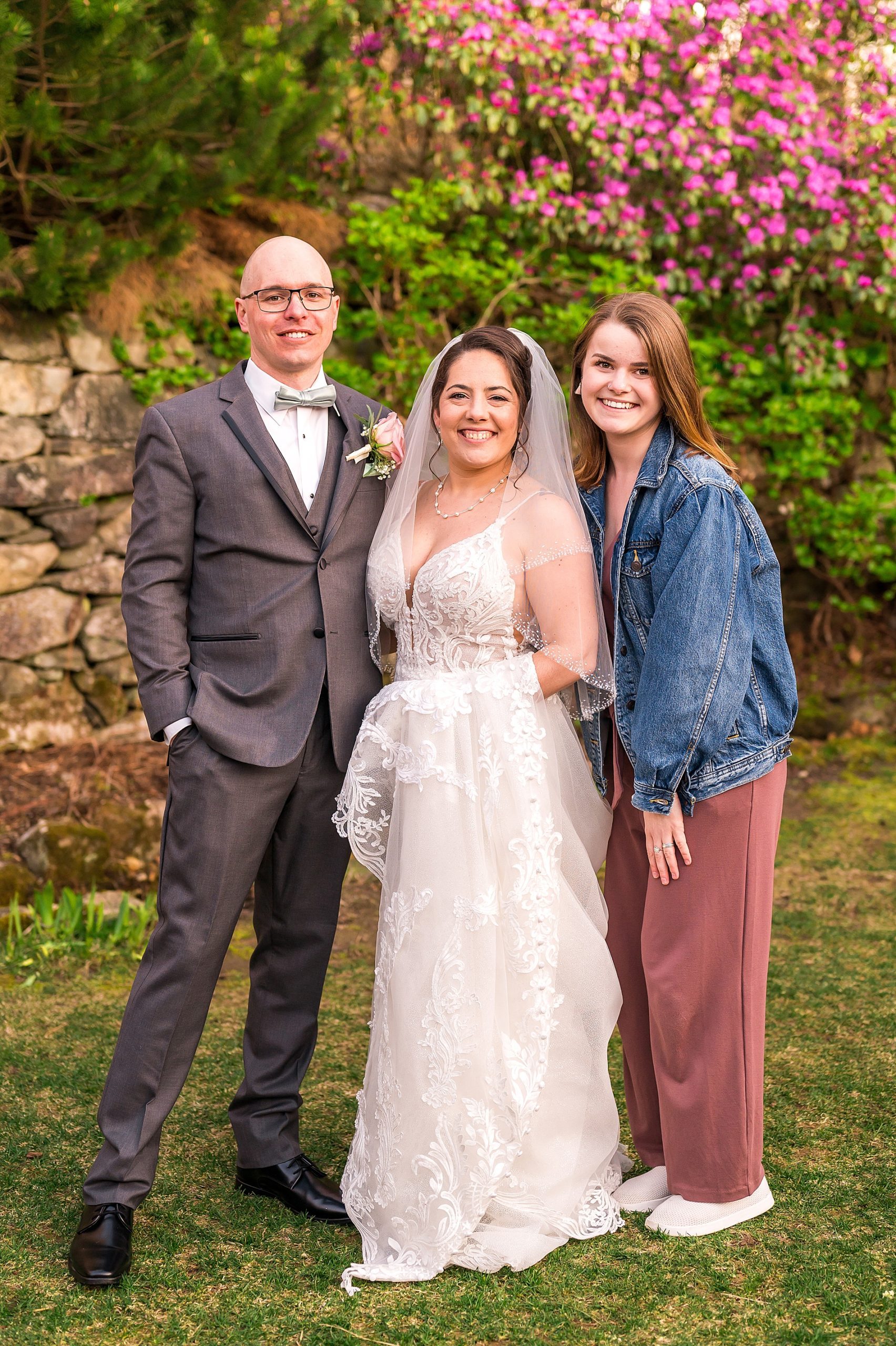 newlyweds with their photographer Allison Clarke, a Southern NH wedding photographer