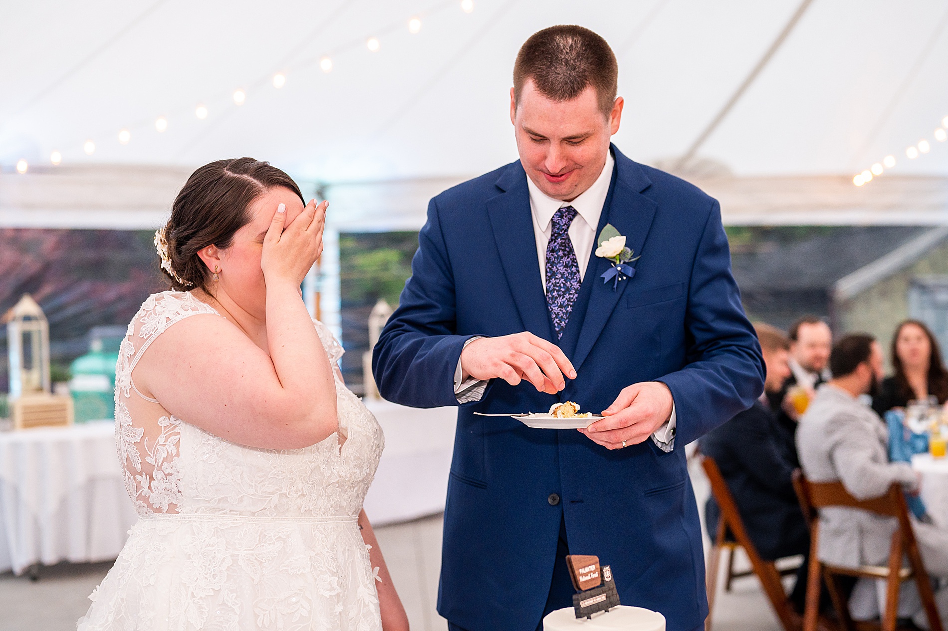 bride reacts to groom feeding himself the cake first