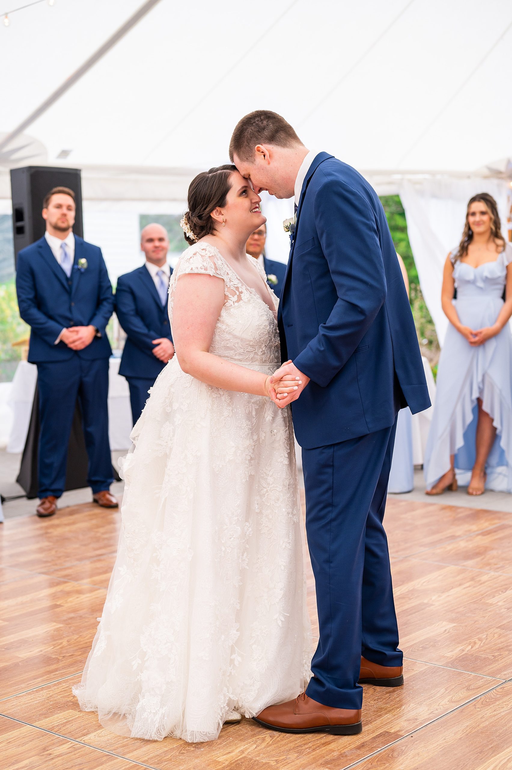 bride and groom share first dance at reception