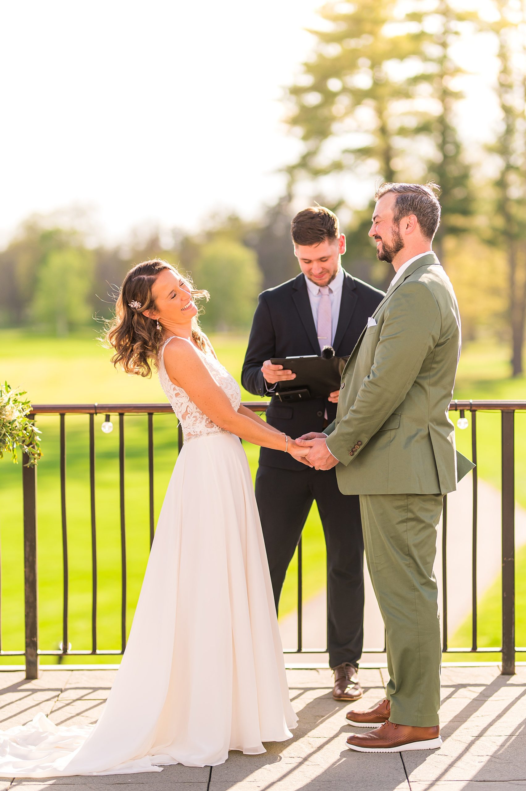 couple share laughter during wedding ceremony