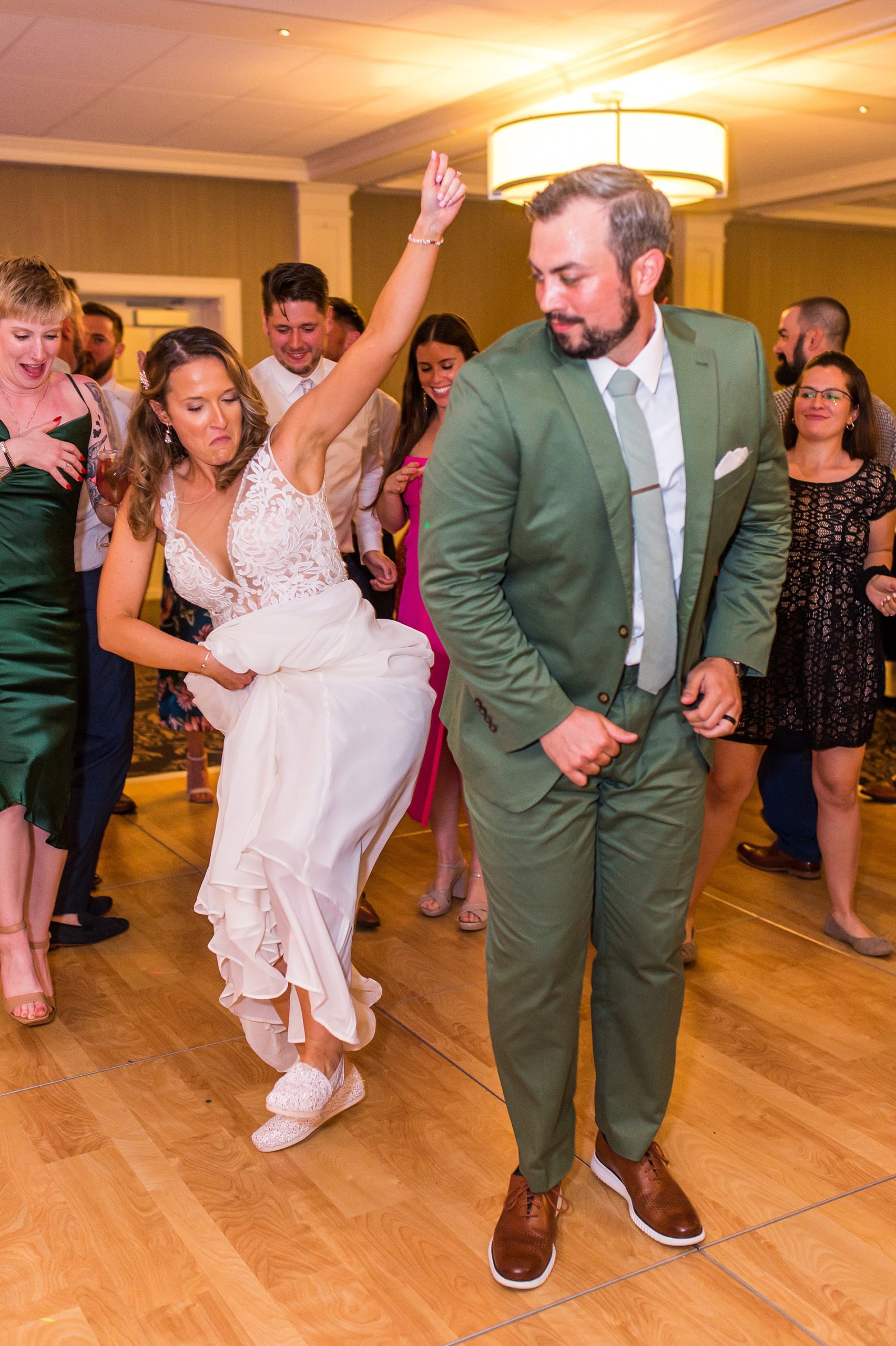 bride and groom celebrate on the dance floor