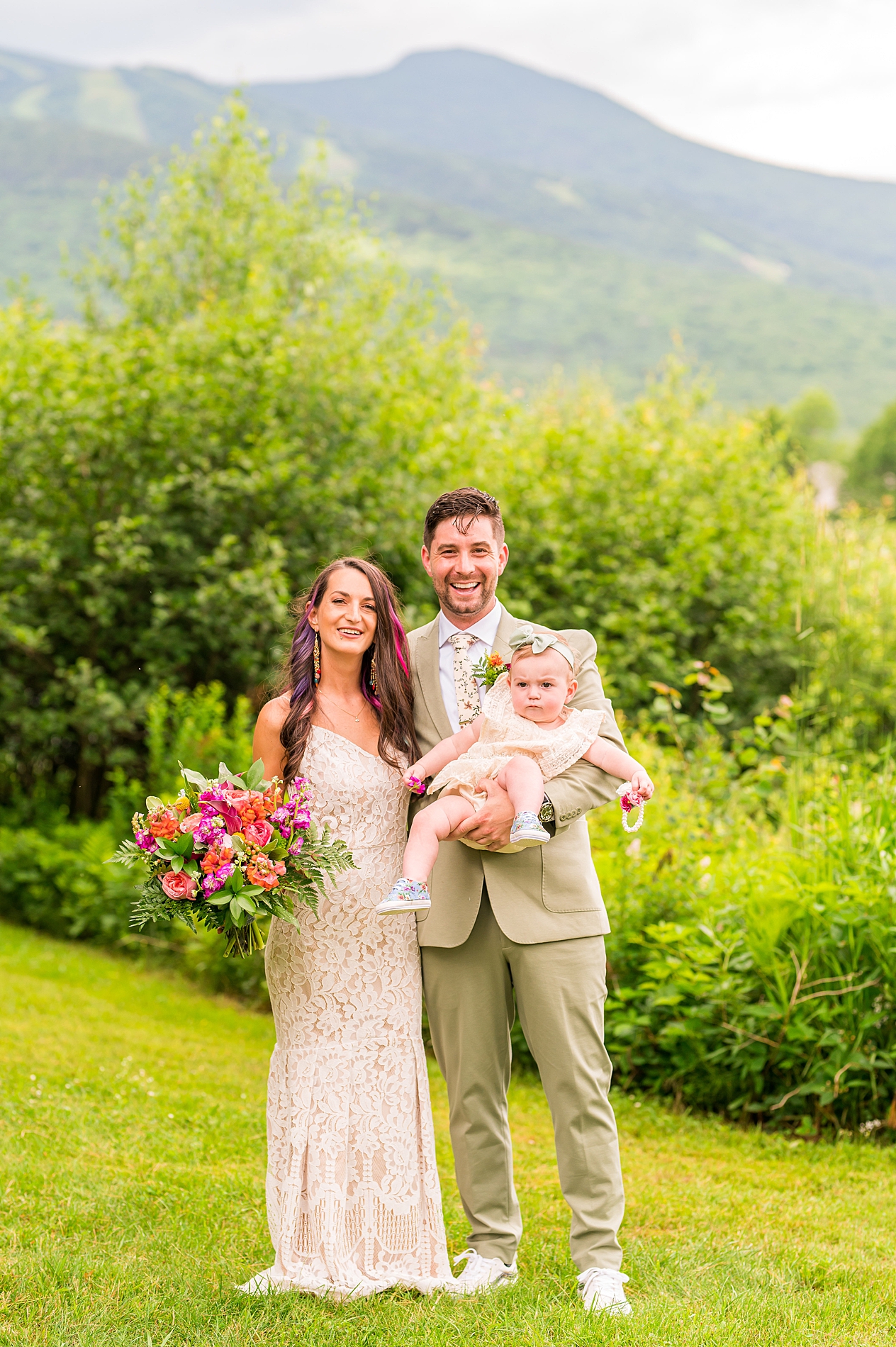 bride and groom with their baby girl at Waterville Valley Resort
