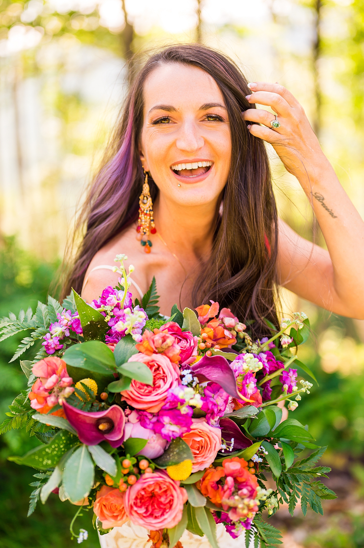 bride holding her colorful wedding flower bouquet   