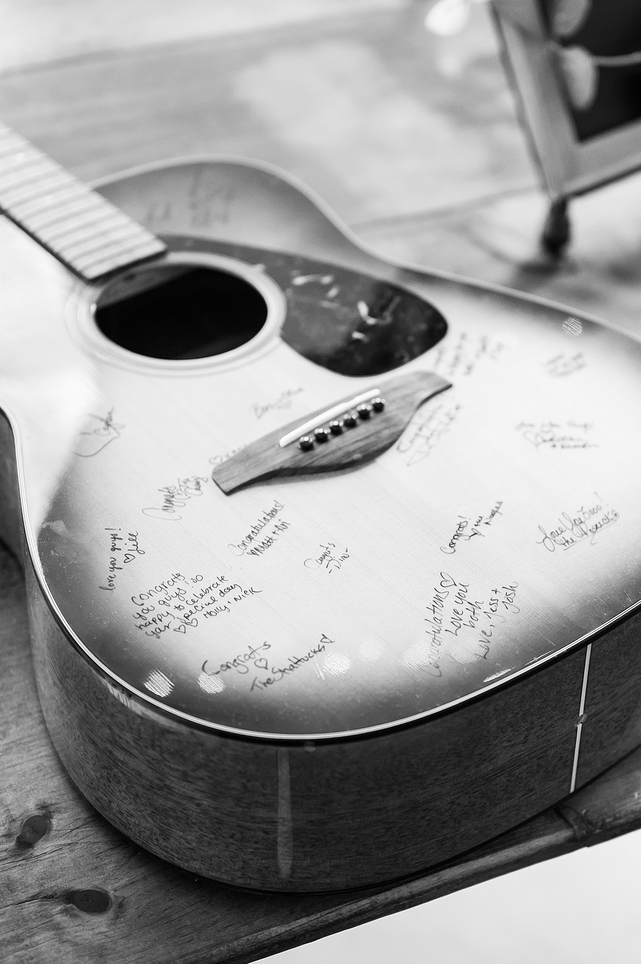 wedding guests sign guitar instead of traditional guest book 
