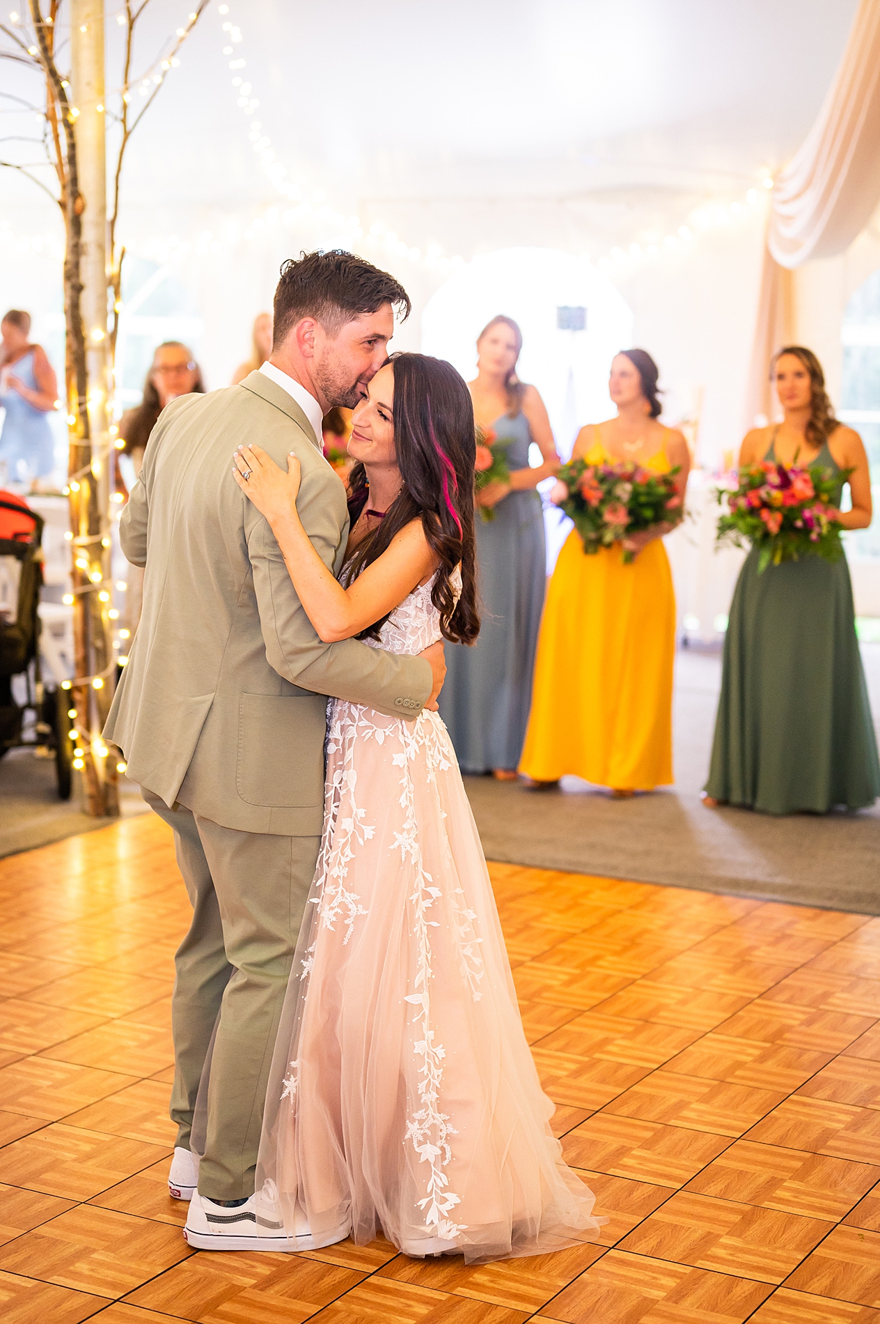 couple share first dance together as husband and wife 