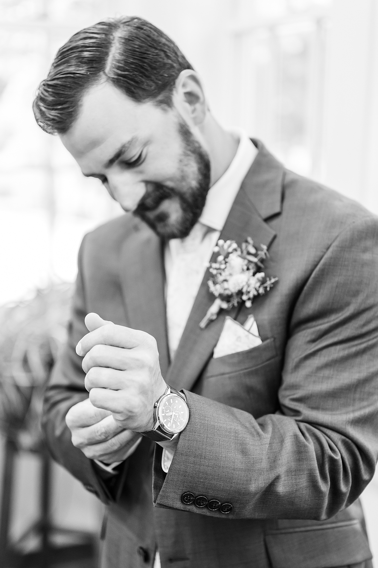 groom putting on watch from bride on wedding day