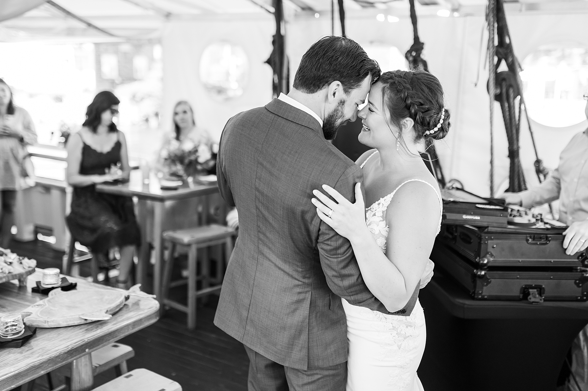 newlyweds dance on sailboat at reception