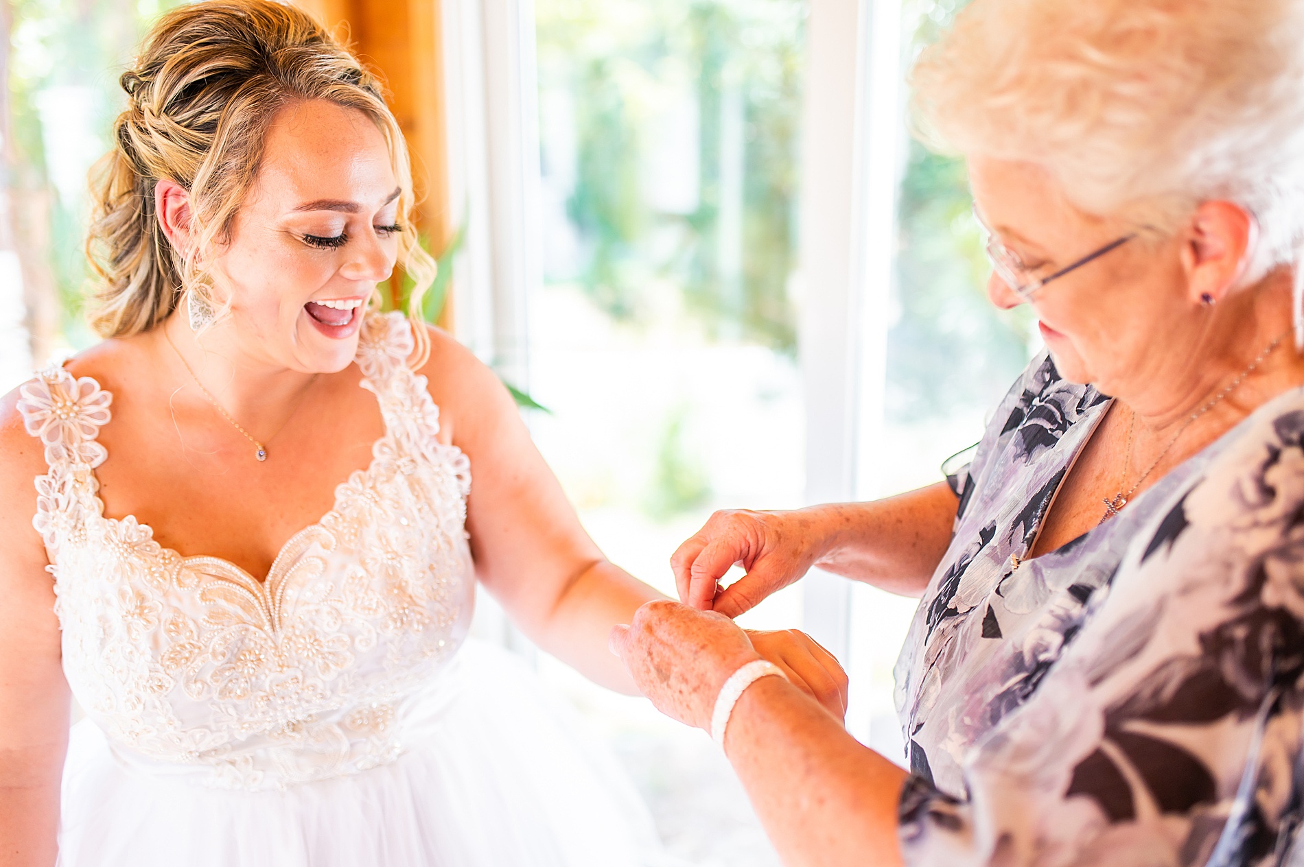 bride's grandmother gives her bracelet to wear for wedding day