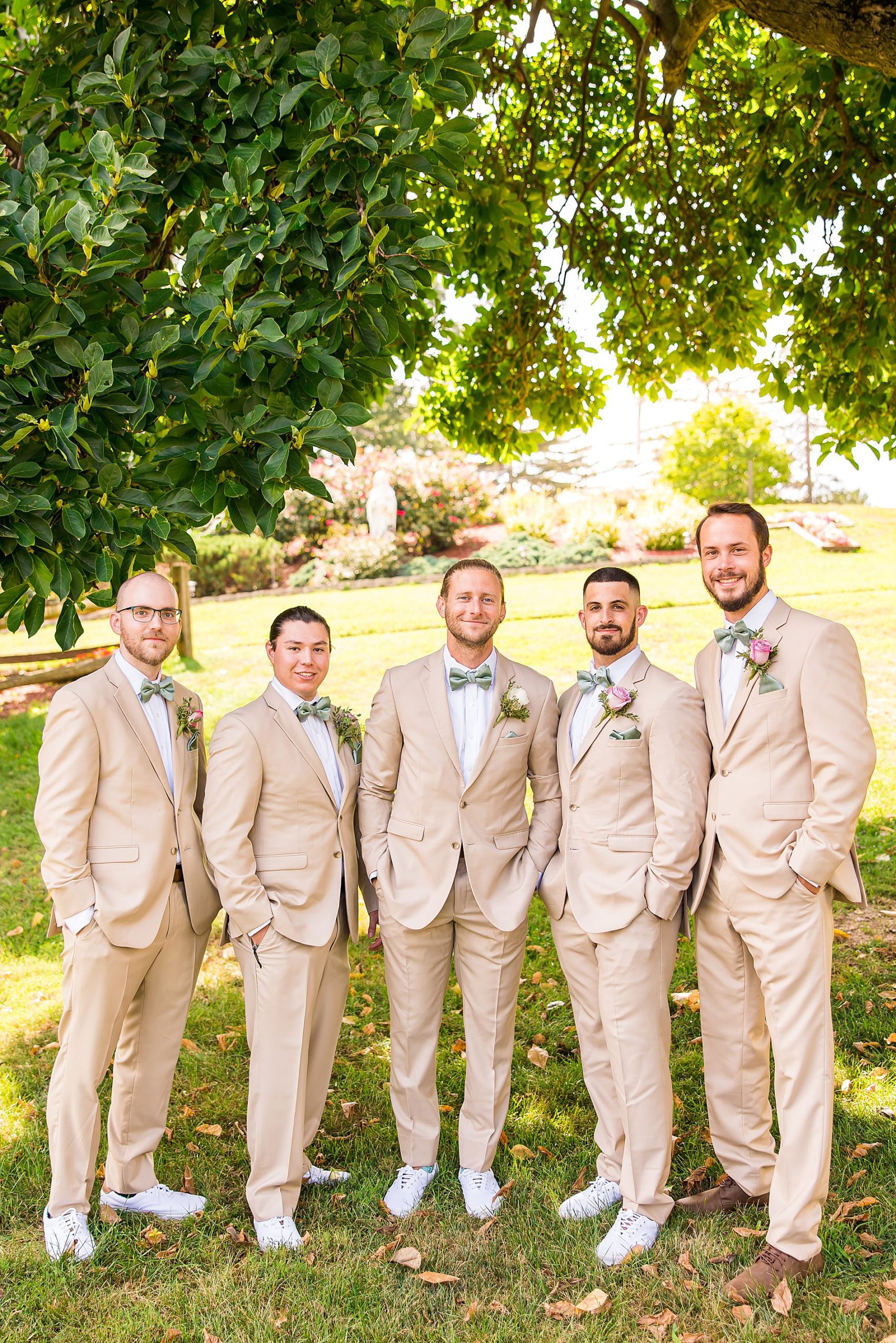 groom and groomsmen in tan suits 