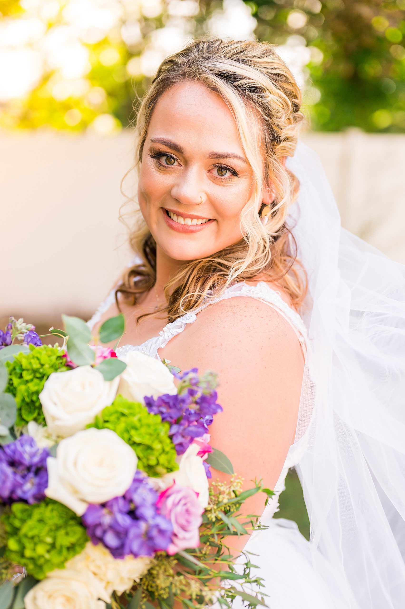 bride portrait holding wedding flower bouquet