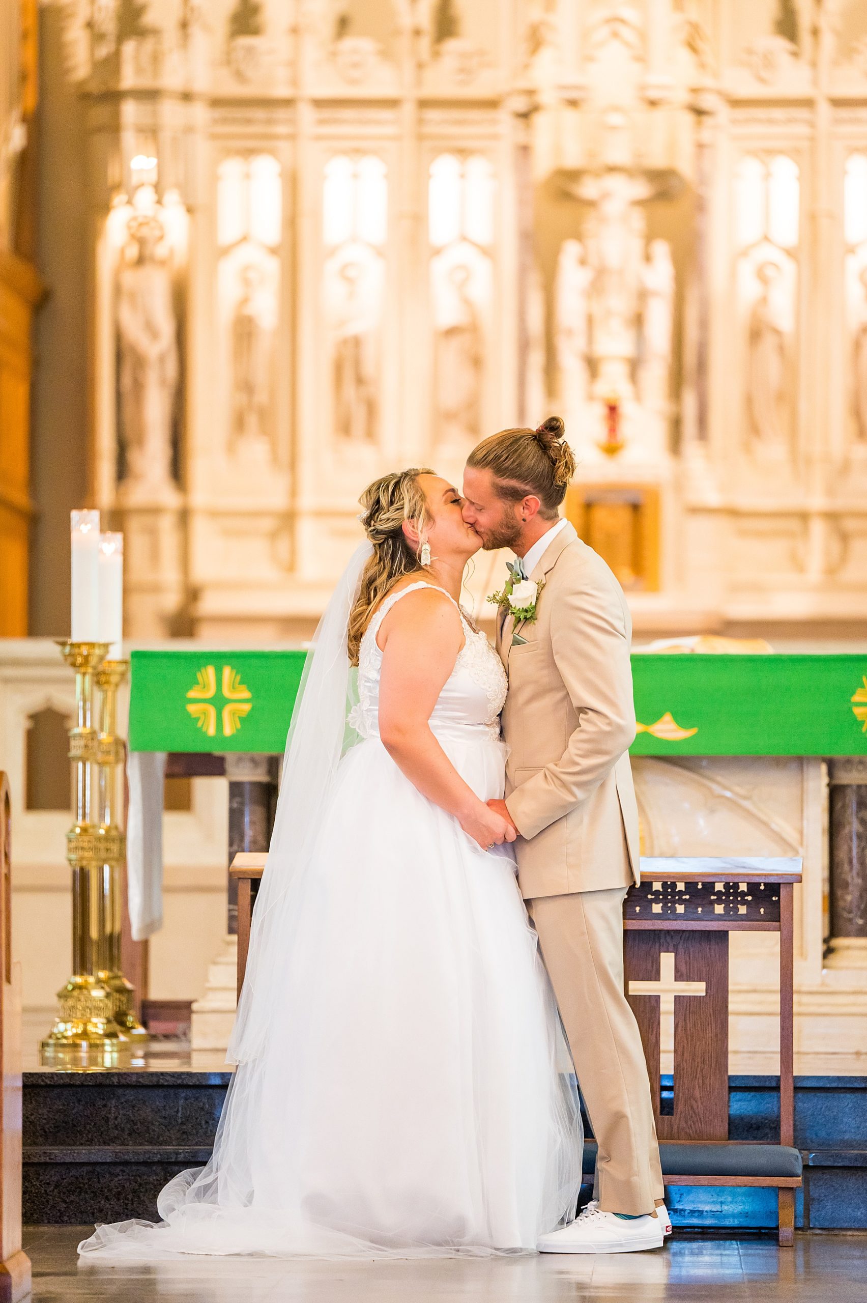 bride and groom kiss as husband and wife