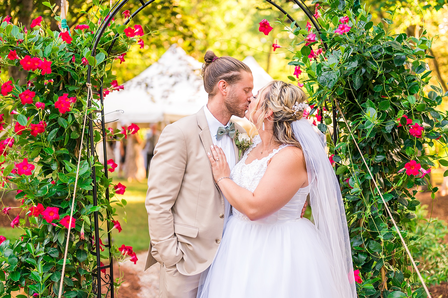 couple kisses at outdoor wedding reception in CT 
