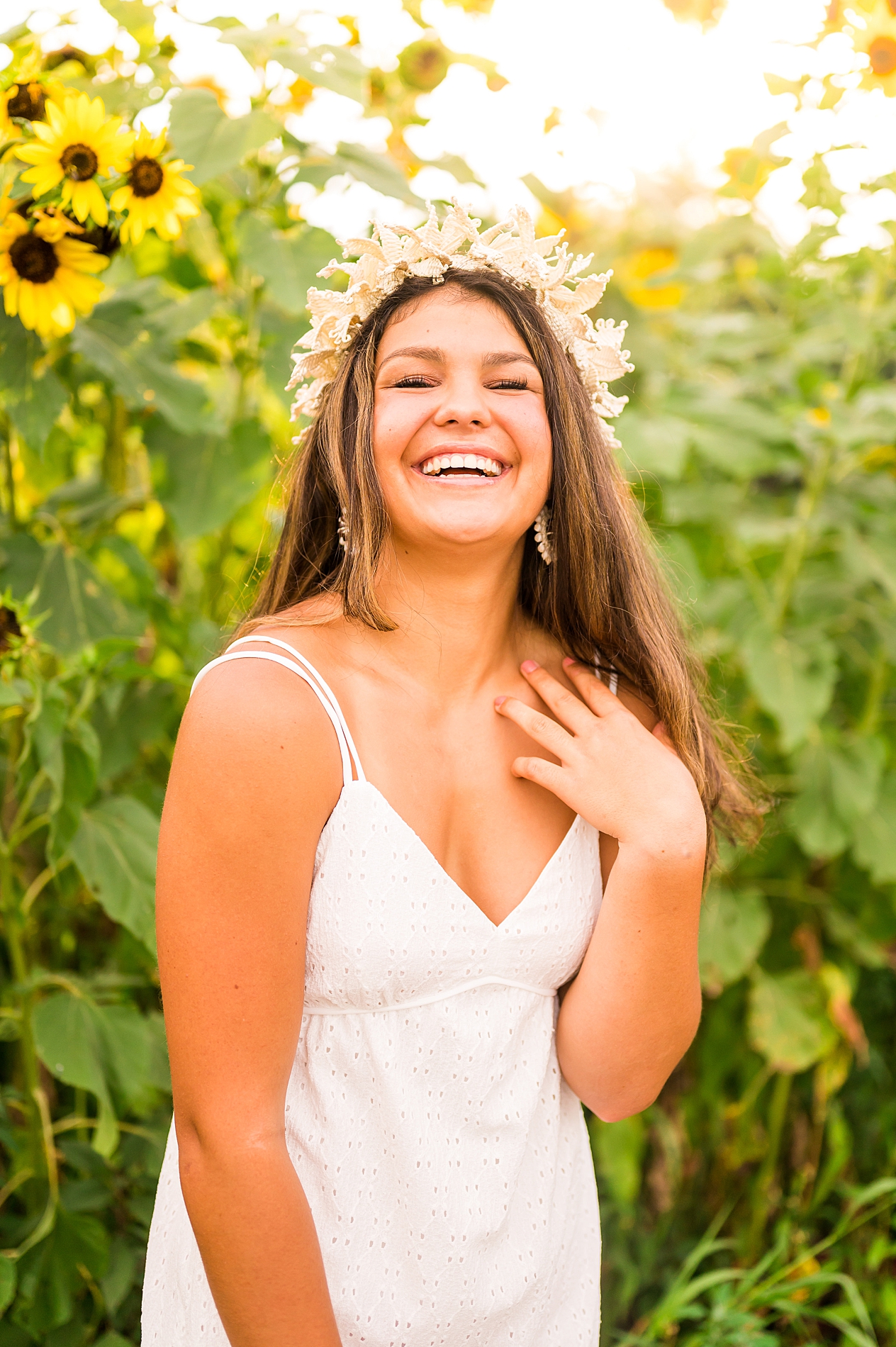 senior girl in field of sunflowers 