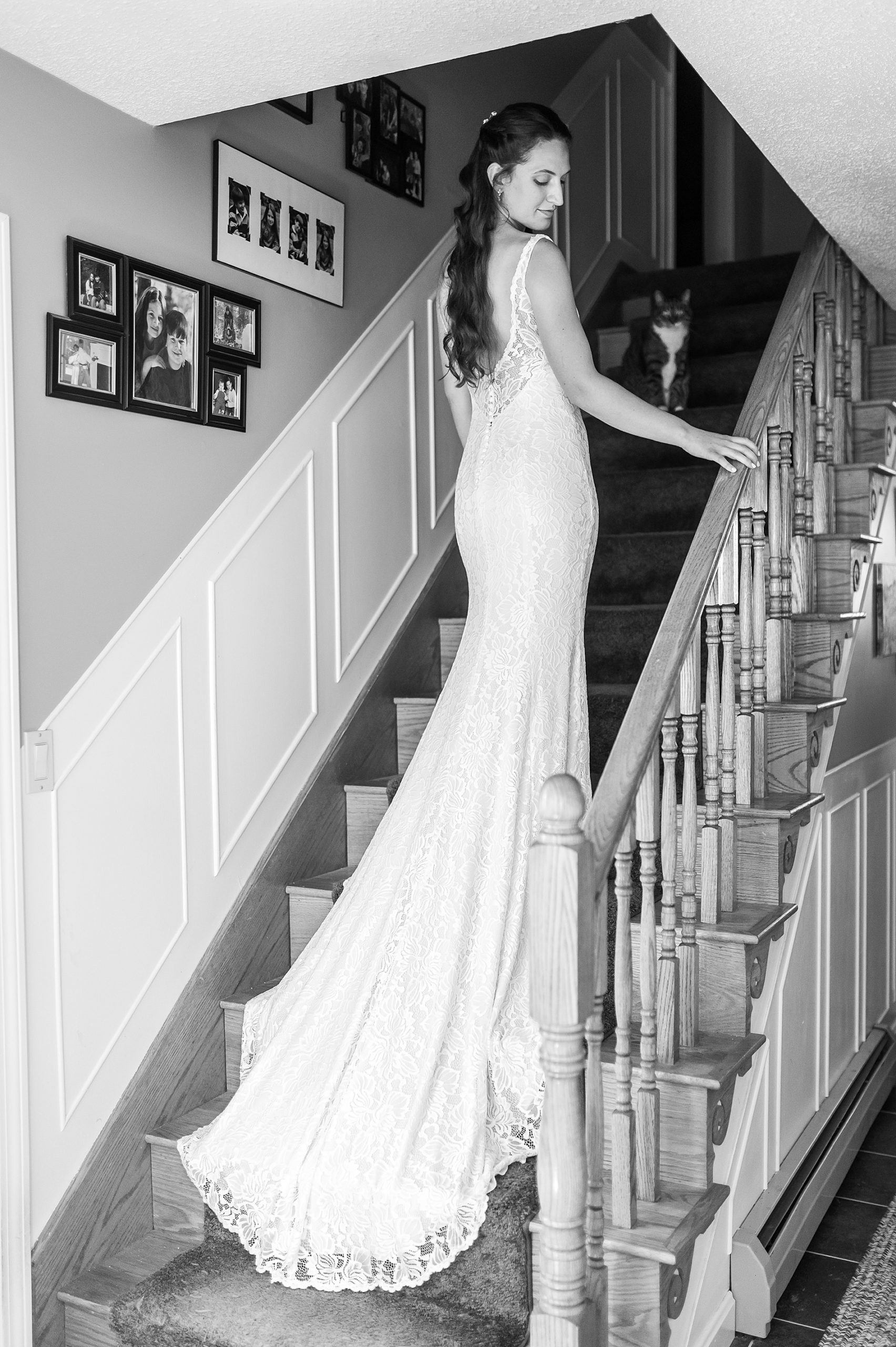 bride walking up the stairs of her family home in wedding dress