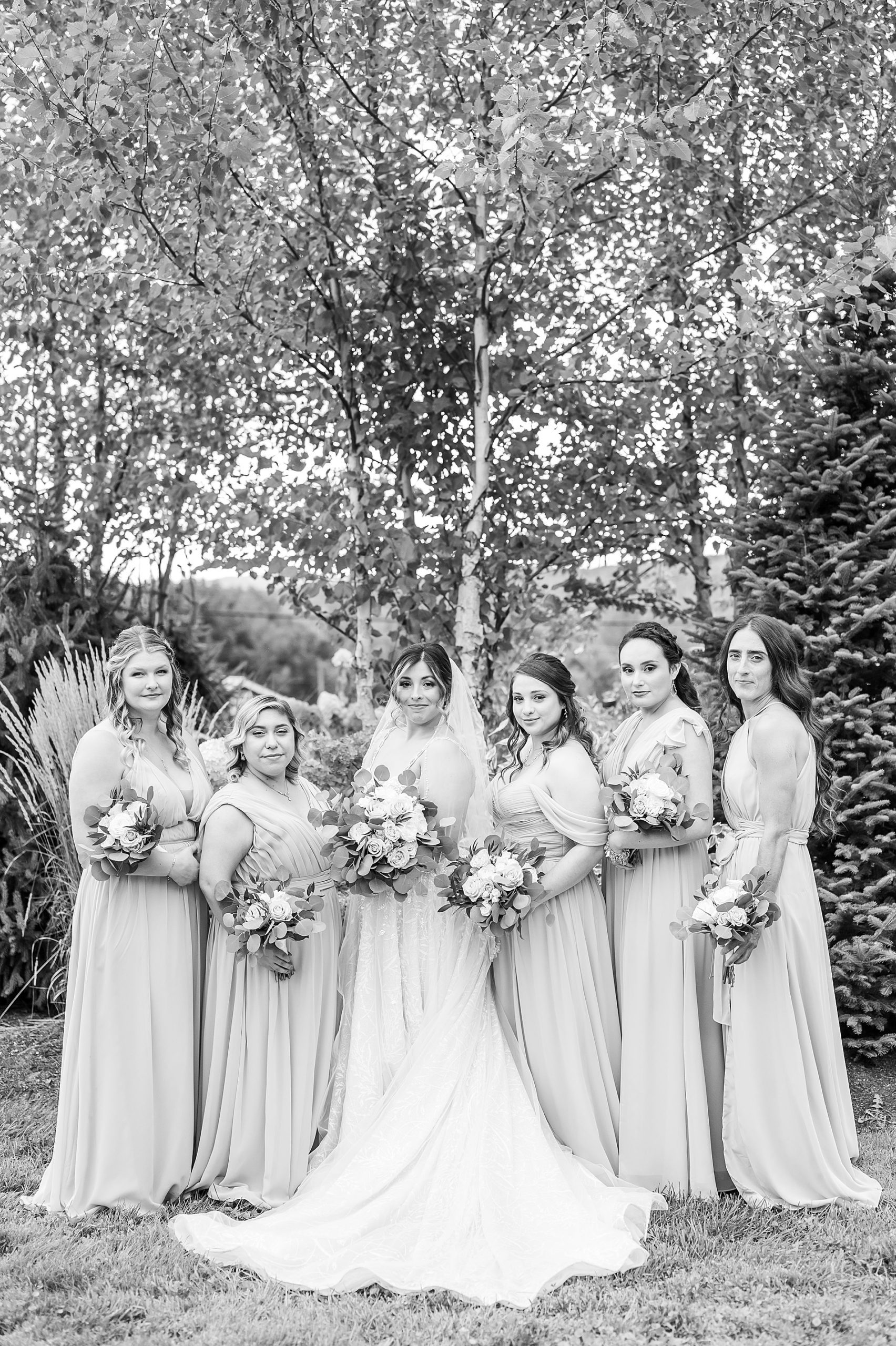 bride with bridesmaids before Bellevue Barn Summer Wedding