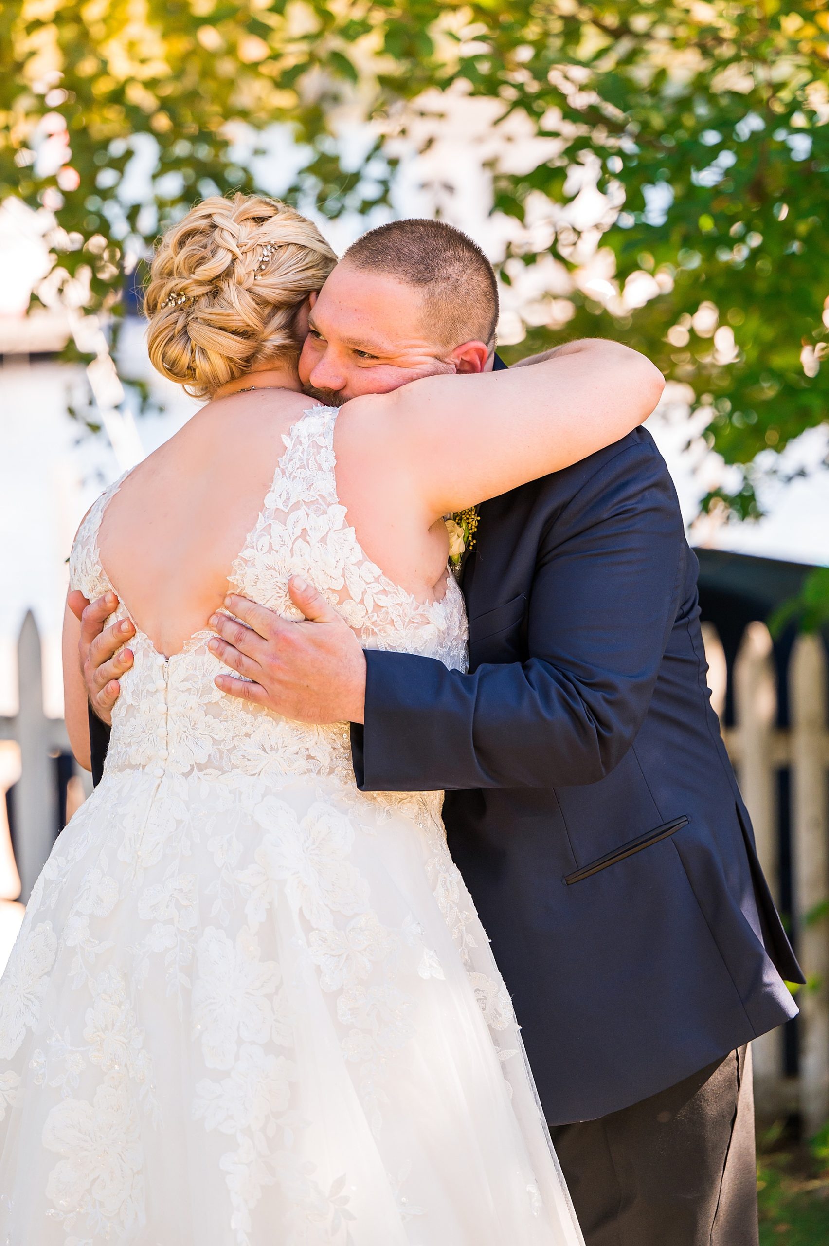 couple hug as they see each other for the first time before wedding 