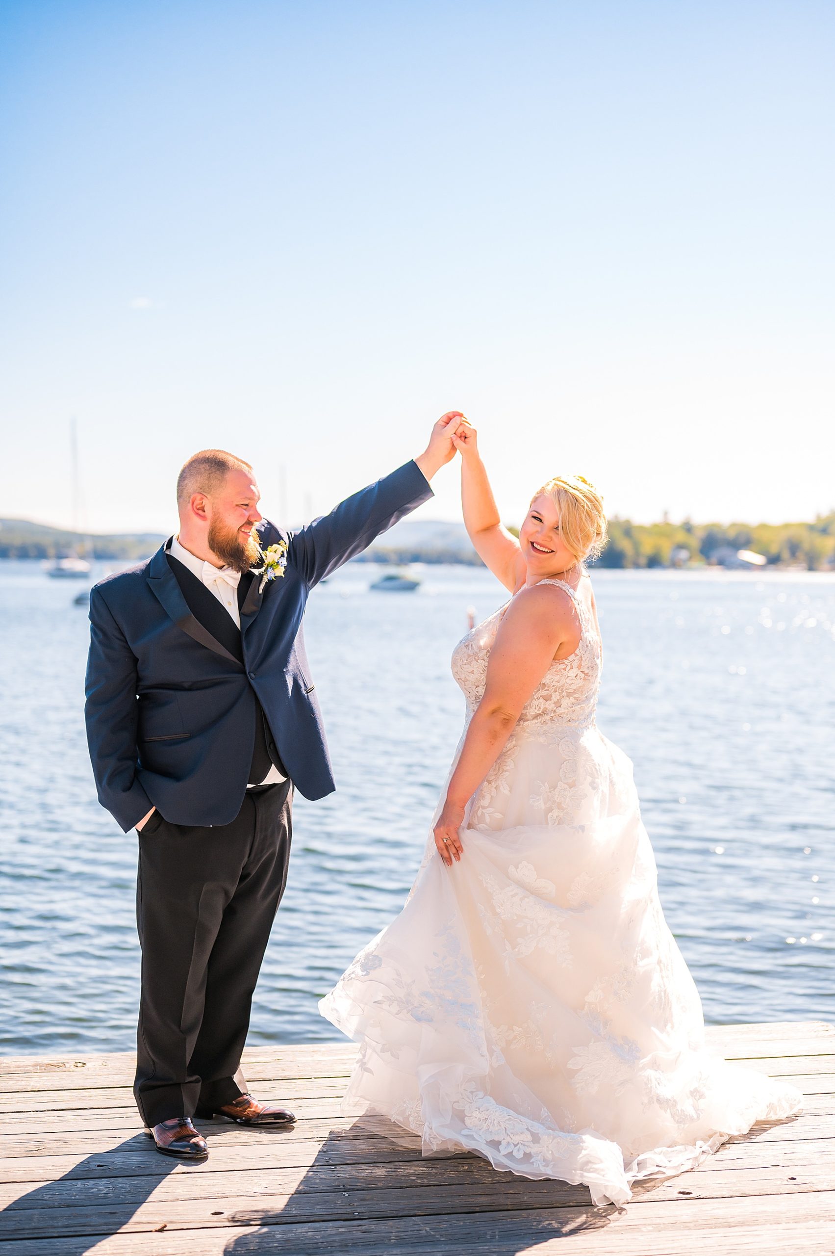 newlyweds dance on boat dock