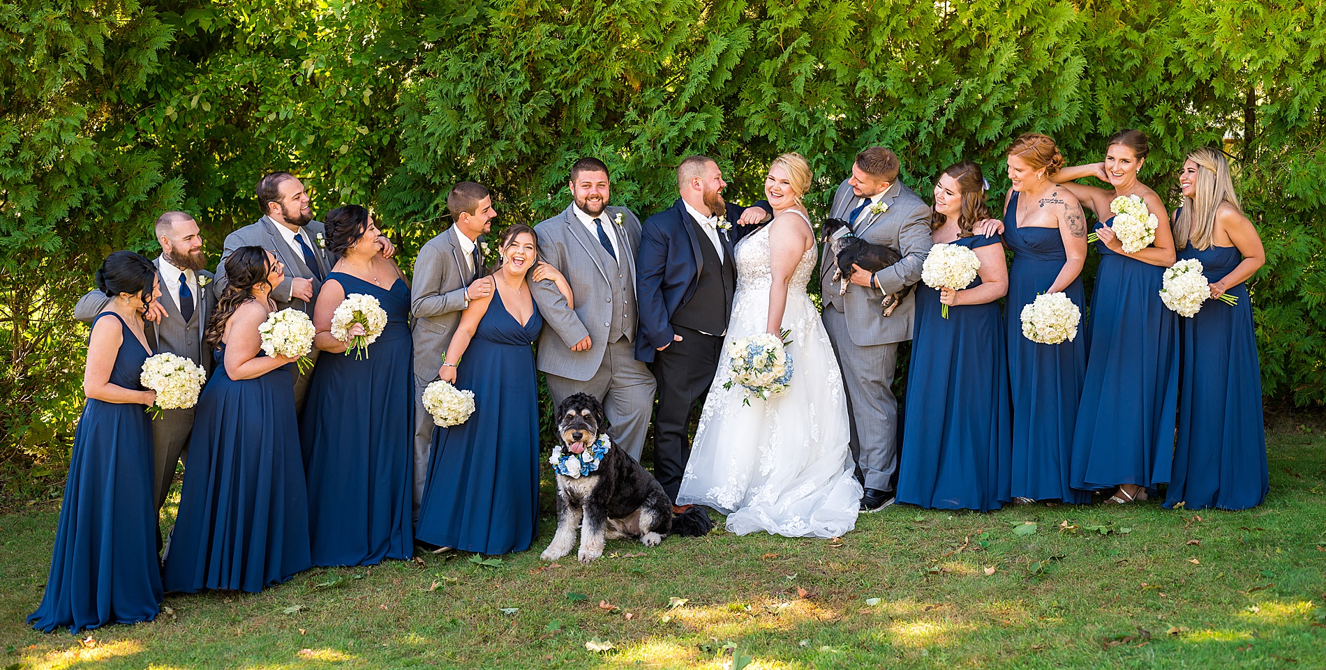 bridal party surrounds bride and groom