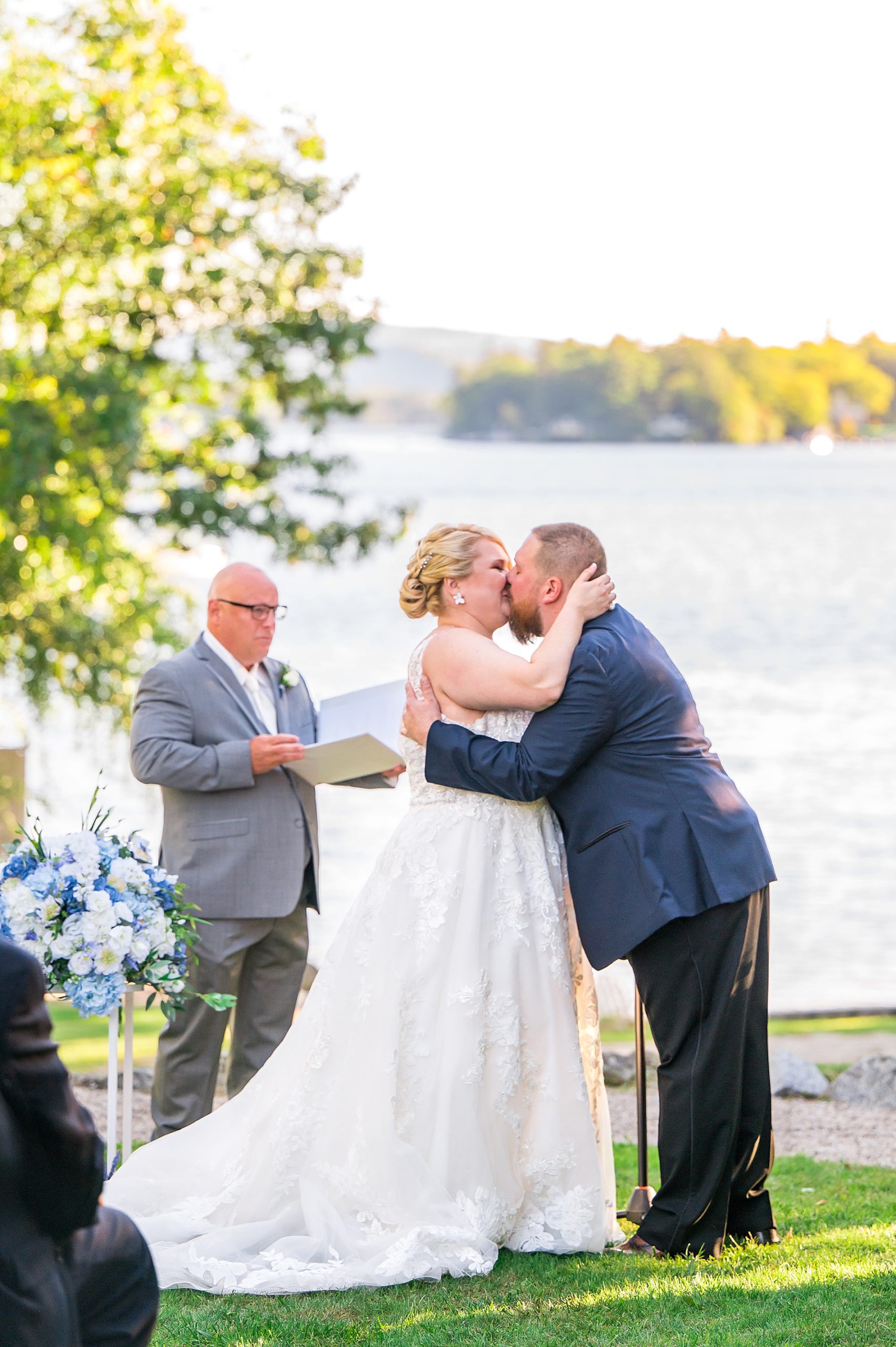 couple kiss at their Wolfeboro Inn Waterfront Wedding