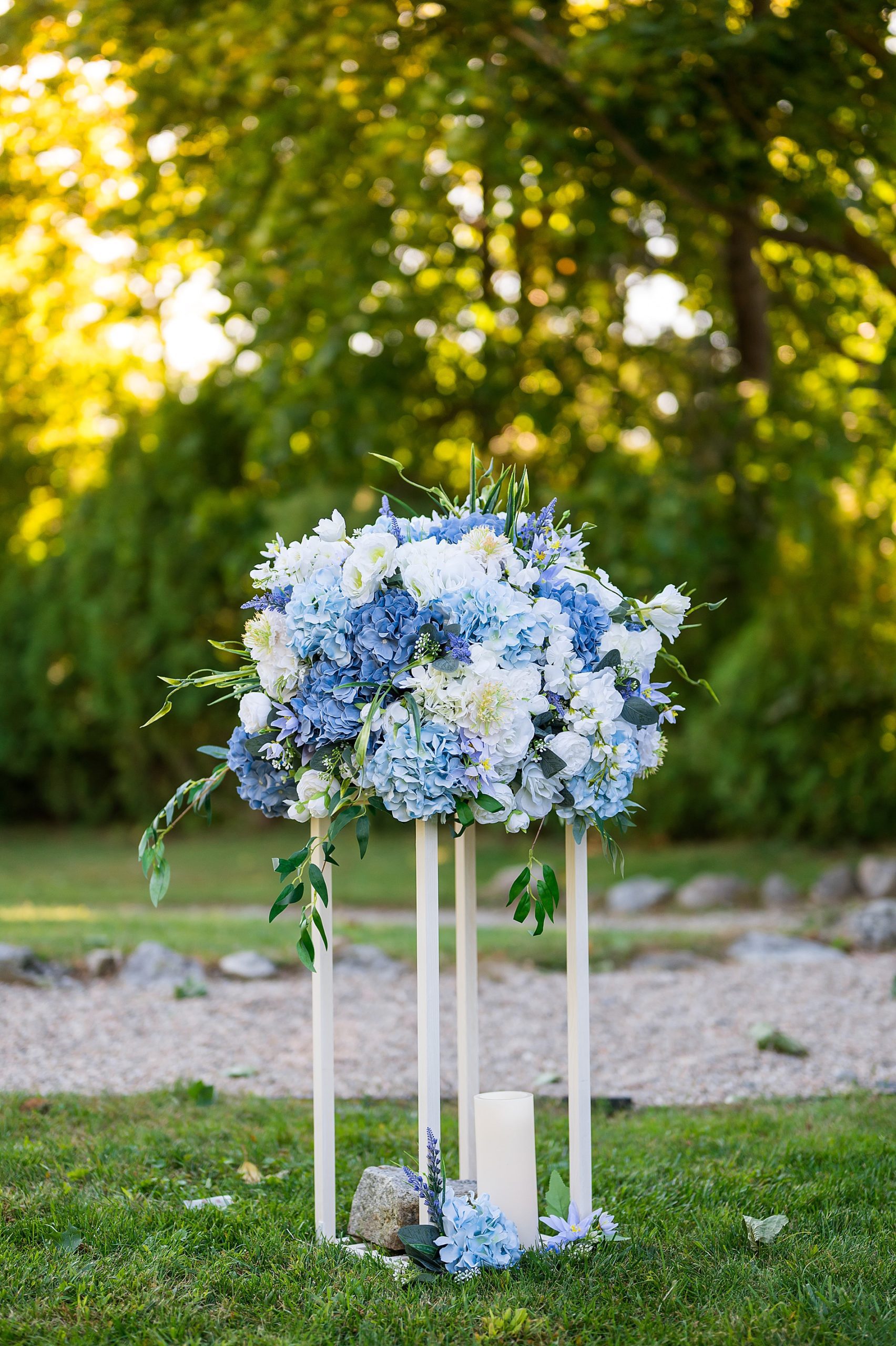 light and dark blue flower arrangement from Wolfeboro Inn Waterfront Wedding ceremony 
