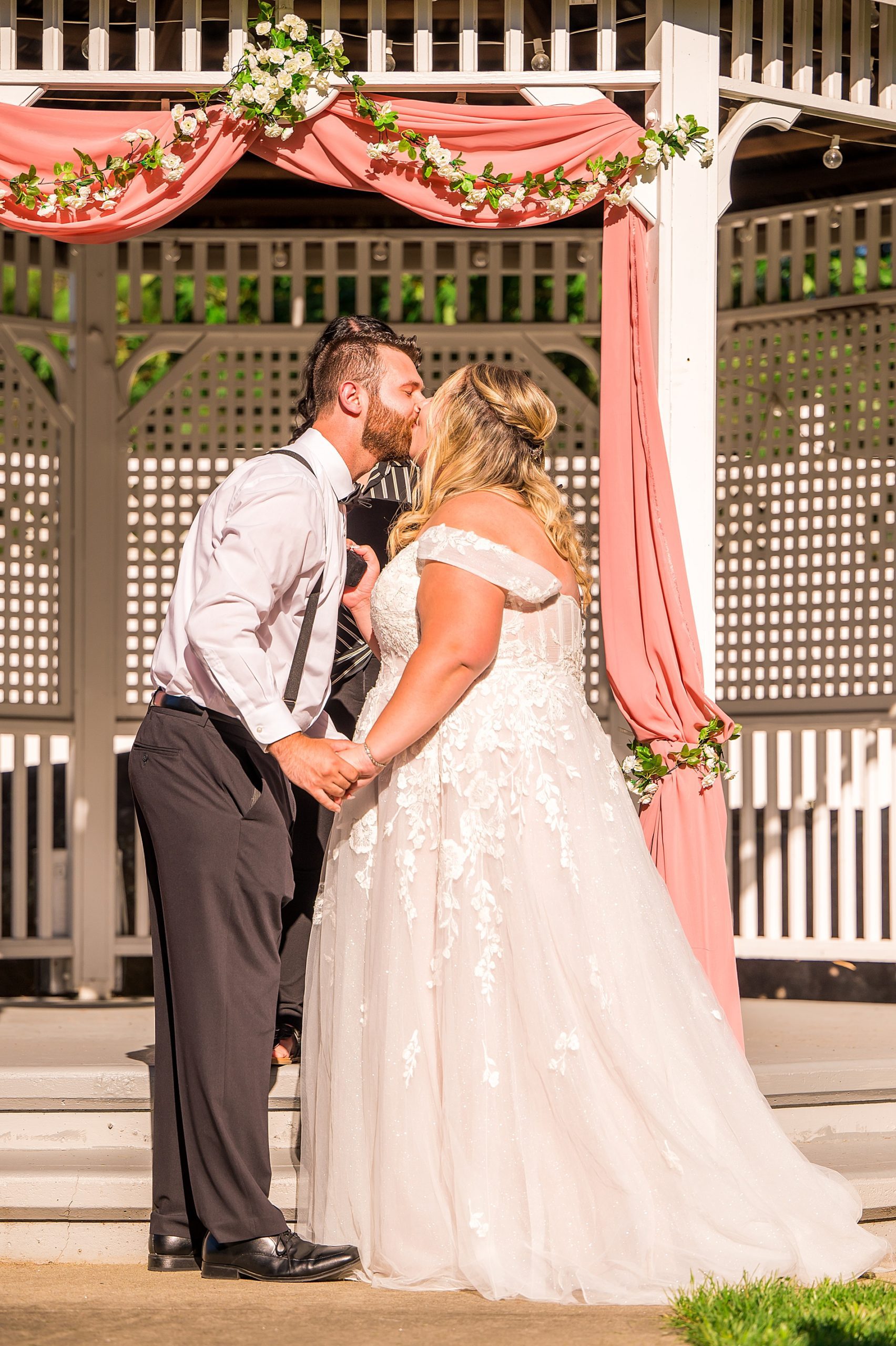 bride and groom kiss for the first time as husband and wife