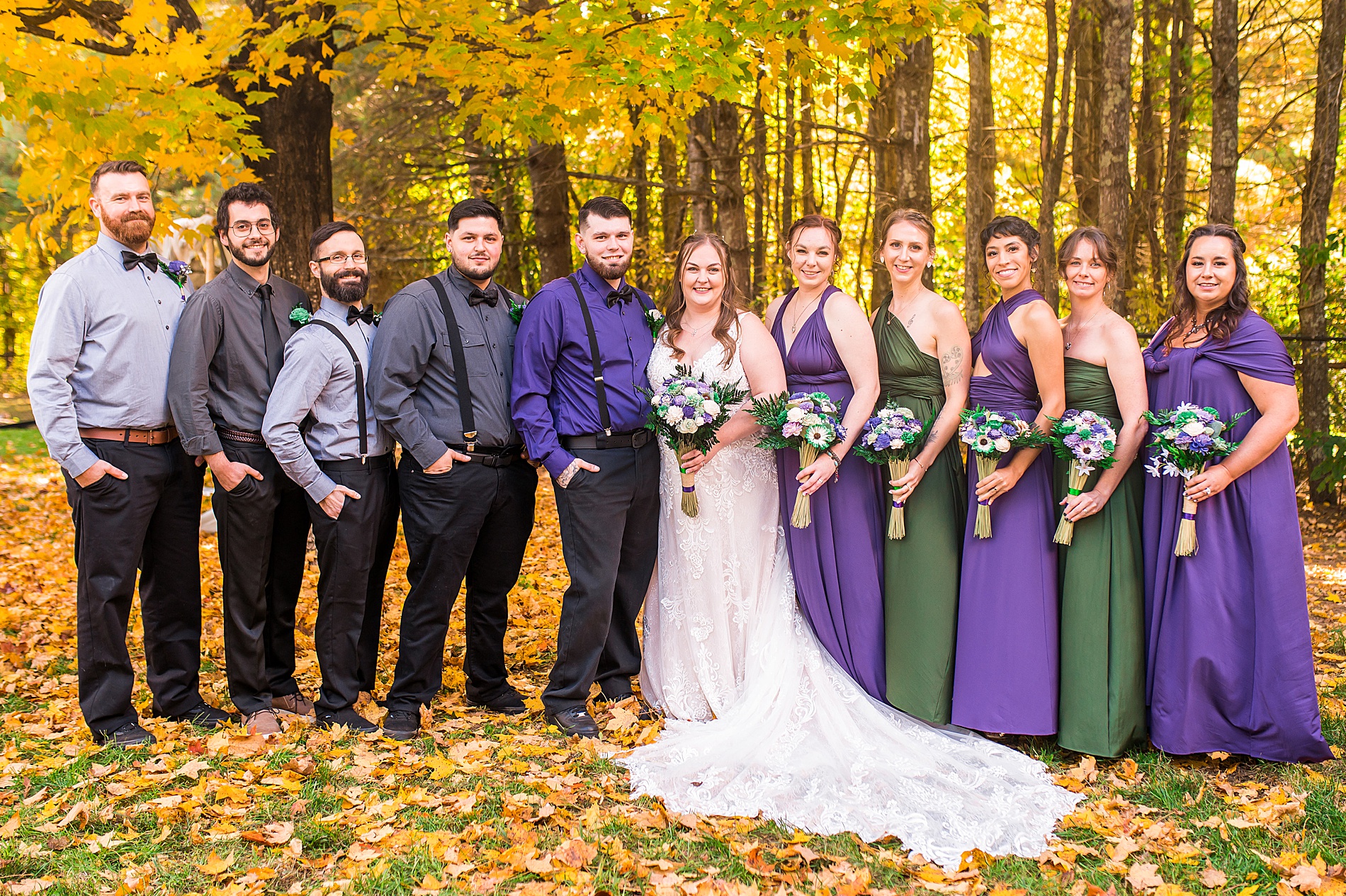 bridal party in green and purple attire