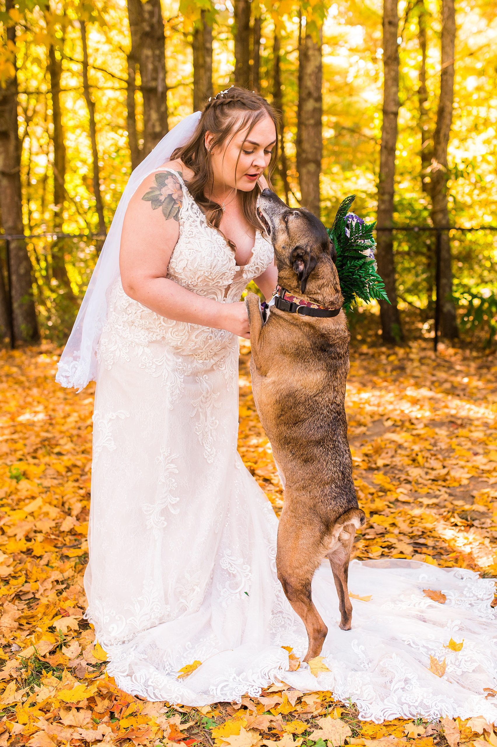 bride with her dog before fall wedding ceremony