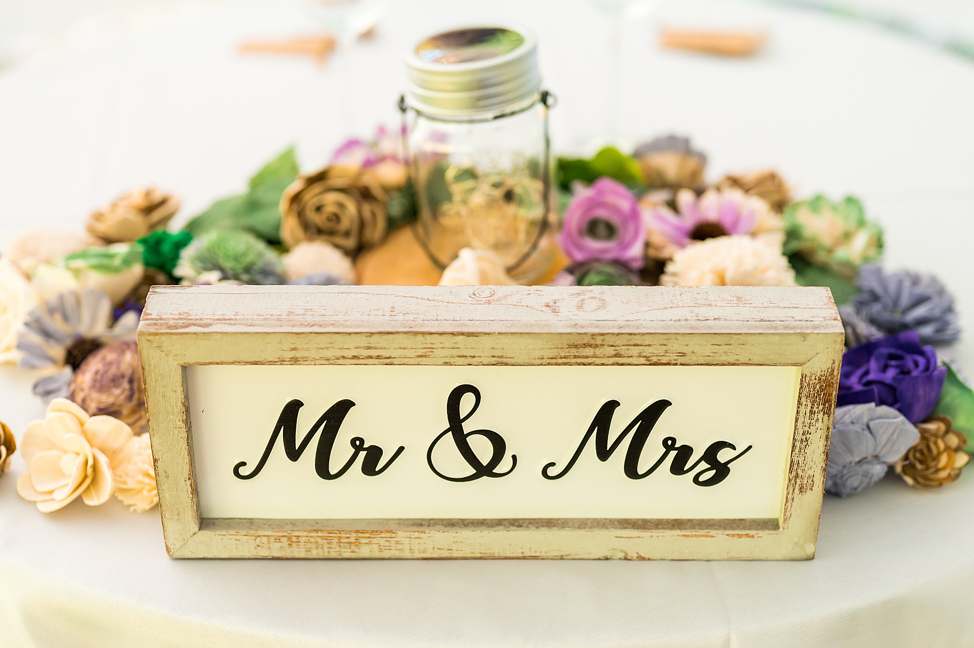 mr. & mrs. sign at outdoor reception