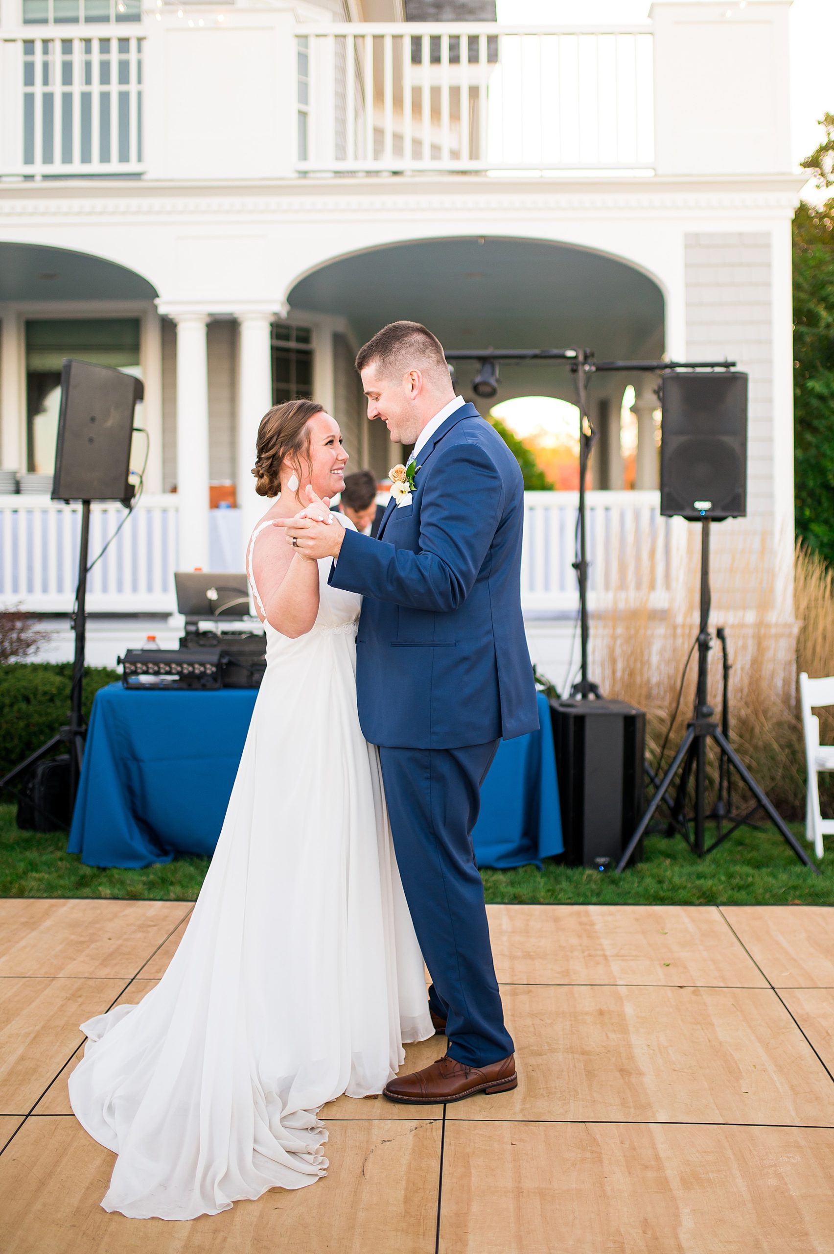 Newlyweds dance as husband and wife at outdoor Oceanfront Autumn Wedding reception