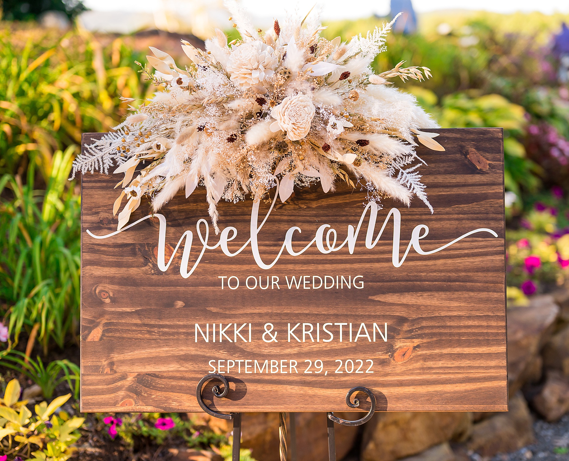 wooden welcome sign into ceremony
