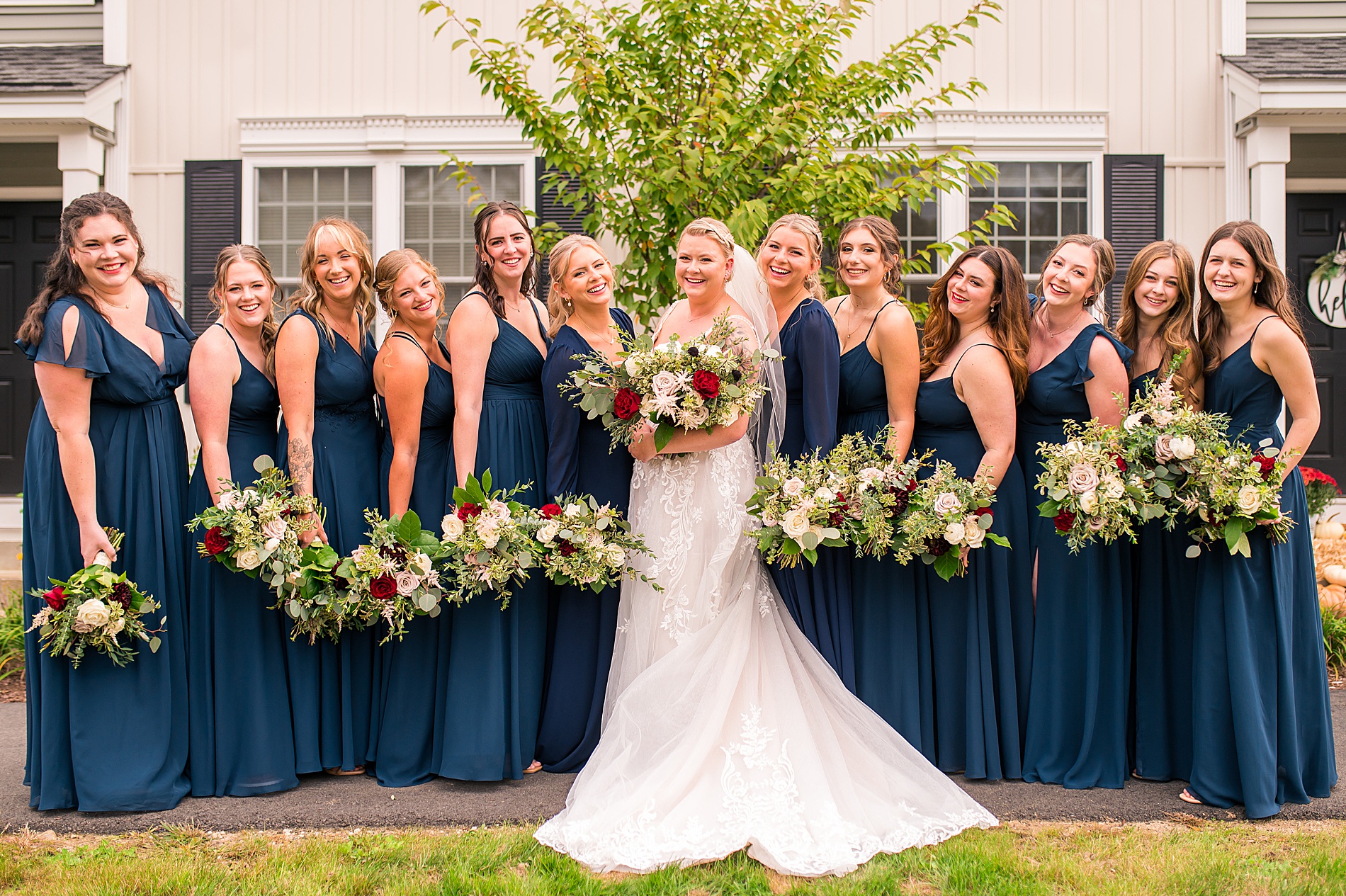 bride with her bridesmaids in navy blue