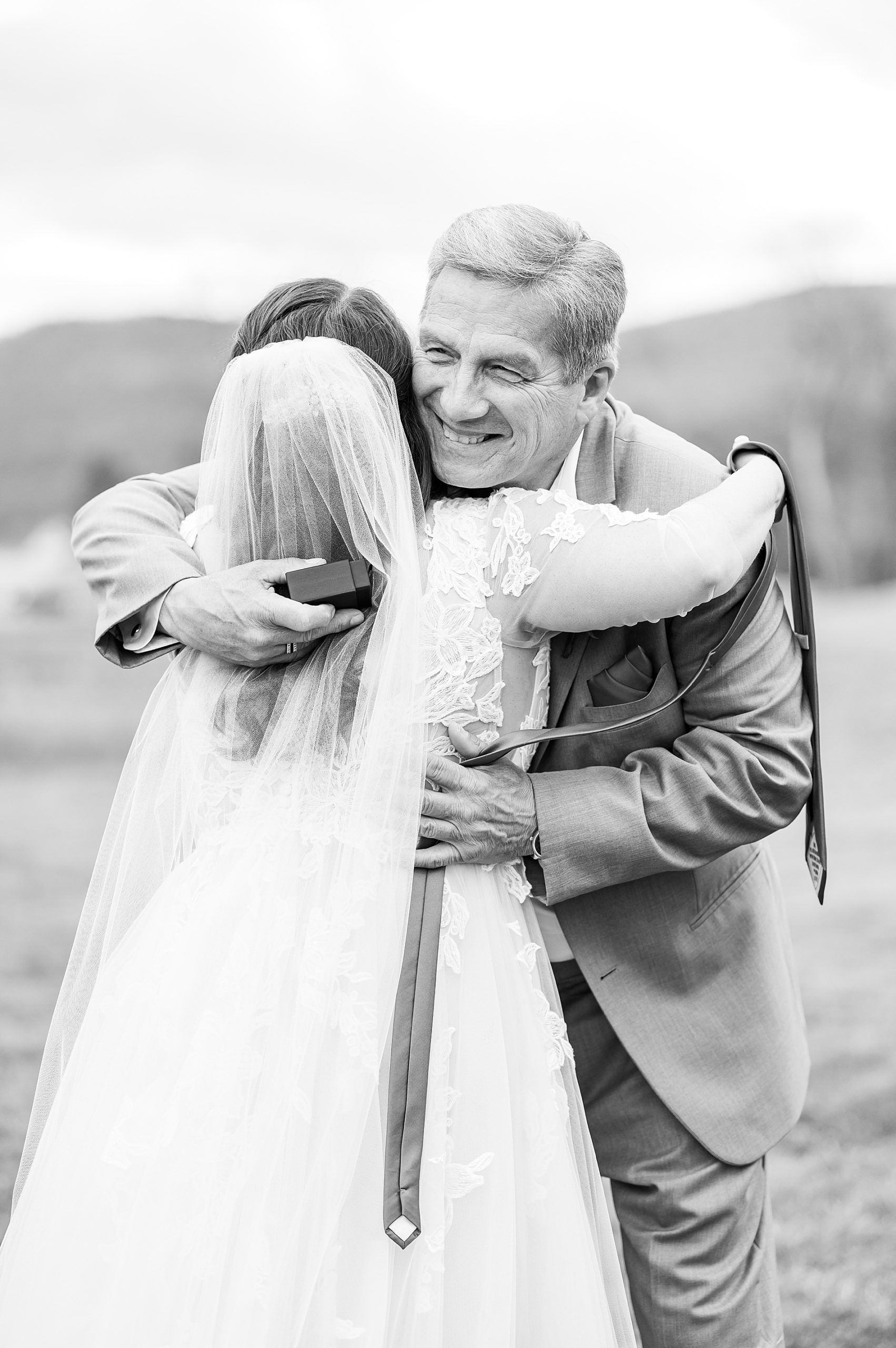 bride hugs her father 