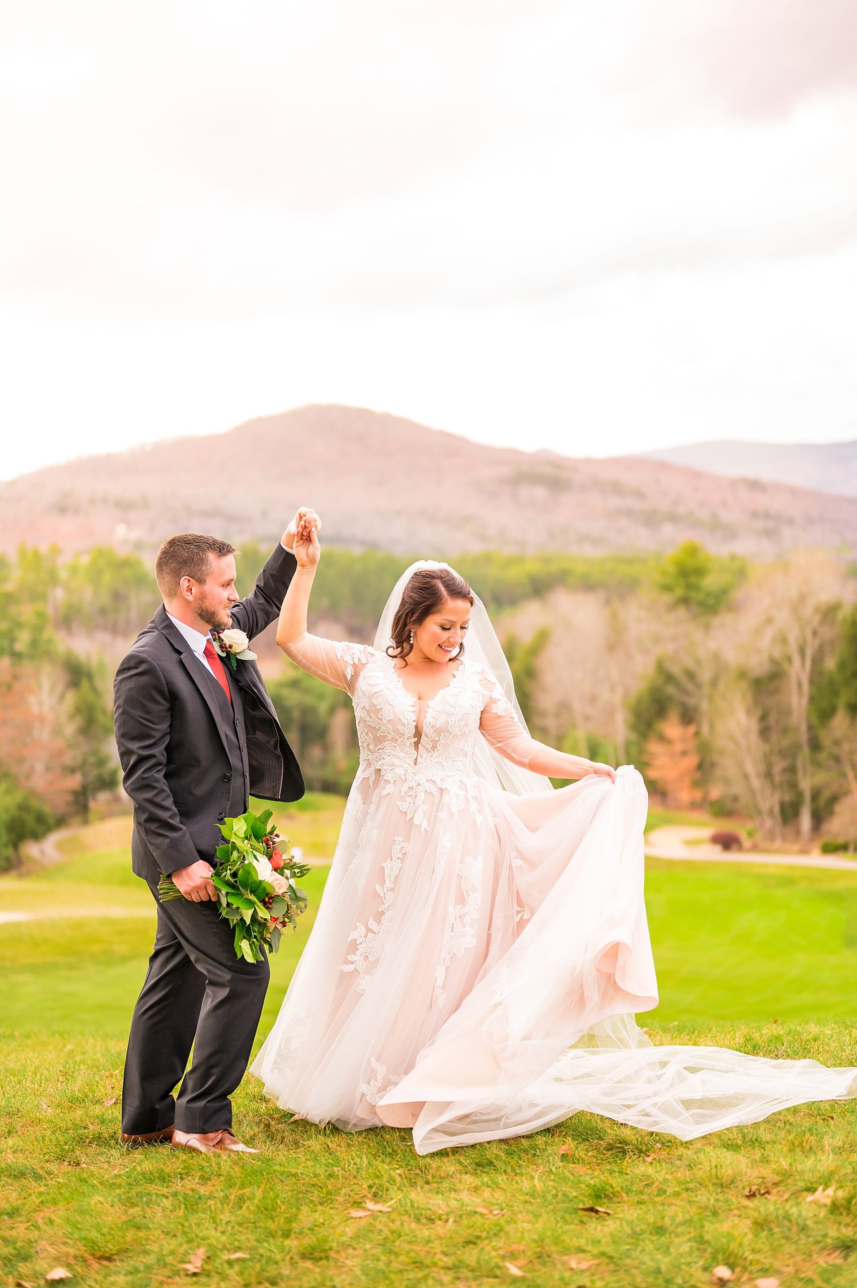 bride and groom dance during wedding portraits