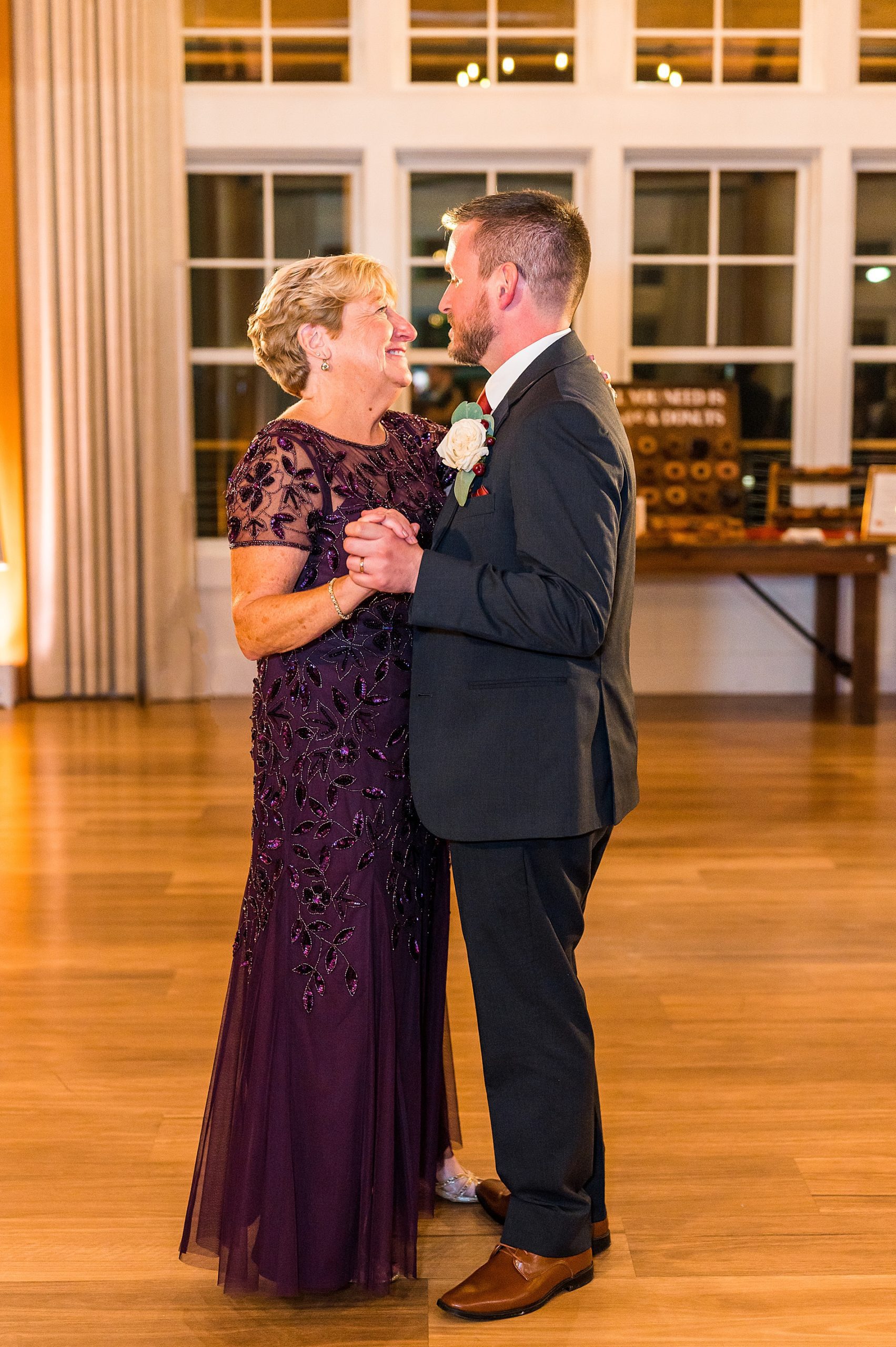 groom dances with his mom at The LakeHouse at Owl's Nest Resort wedding