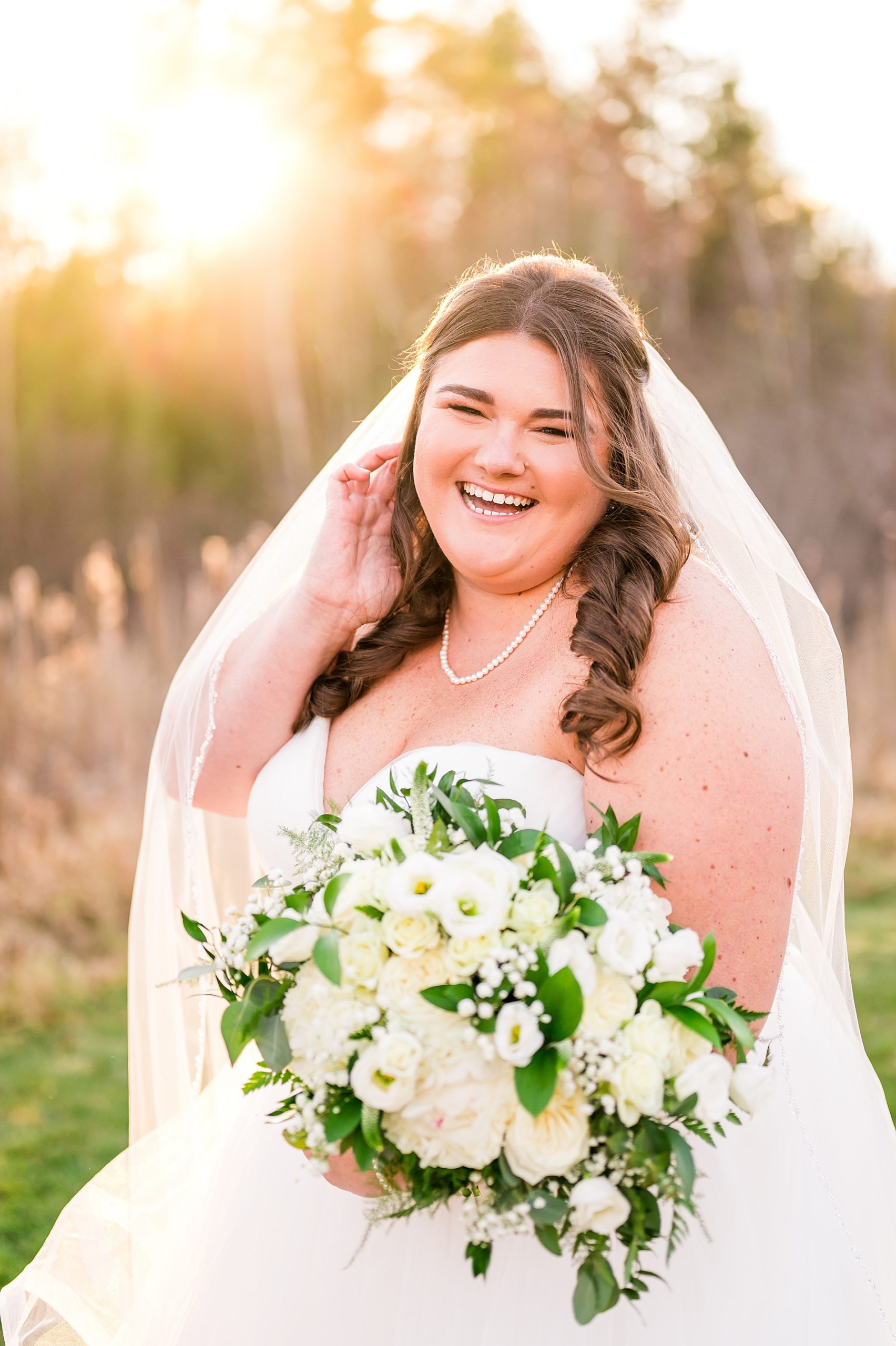 bride laughing during portraits before Concord New Hampshire Wedding