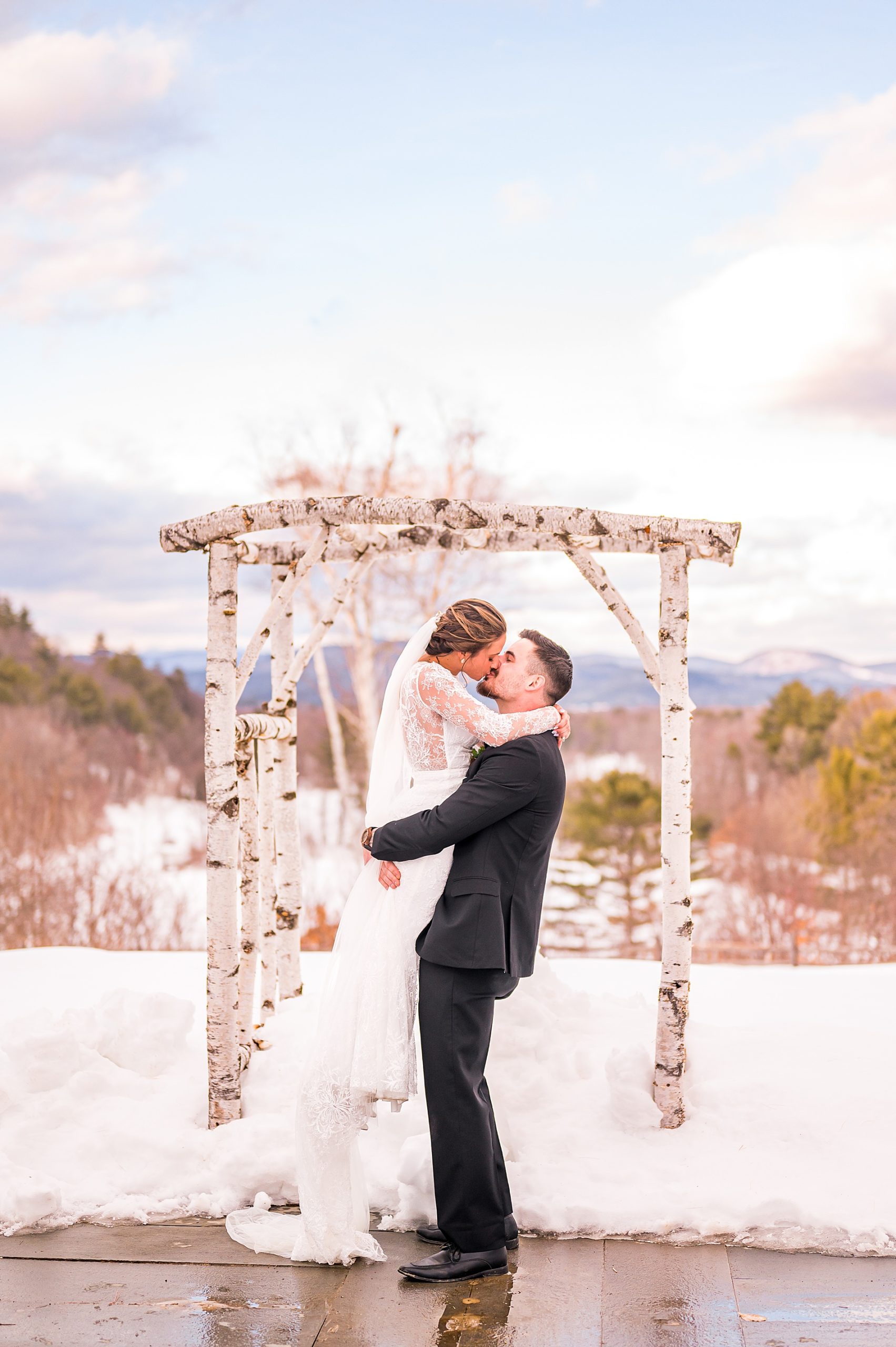 epic kiss between bride and groom during Elegant Winter Wedding