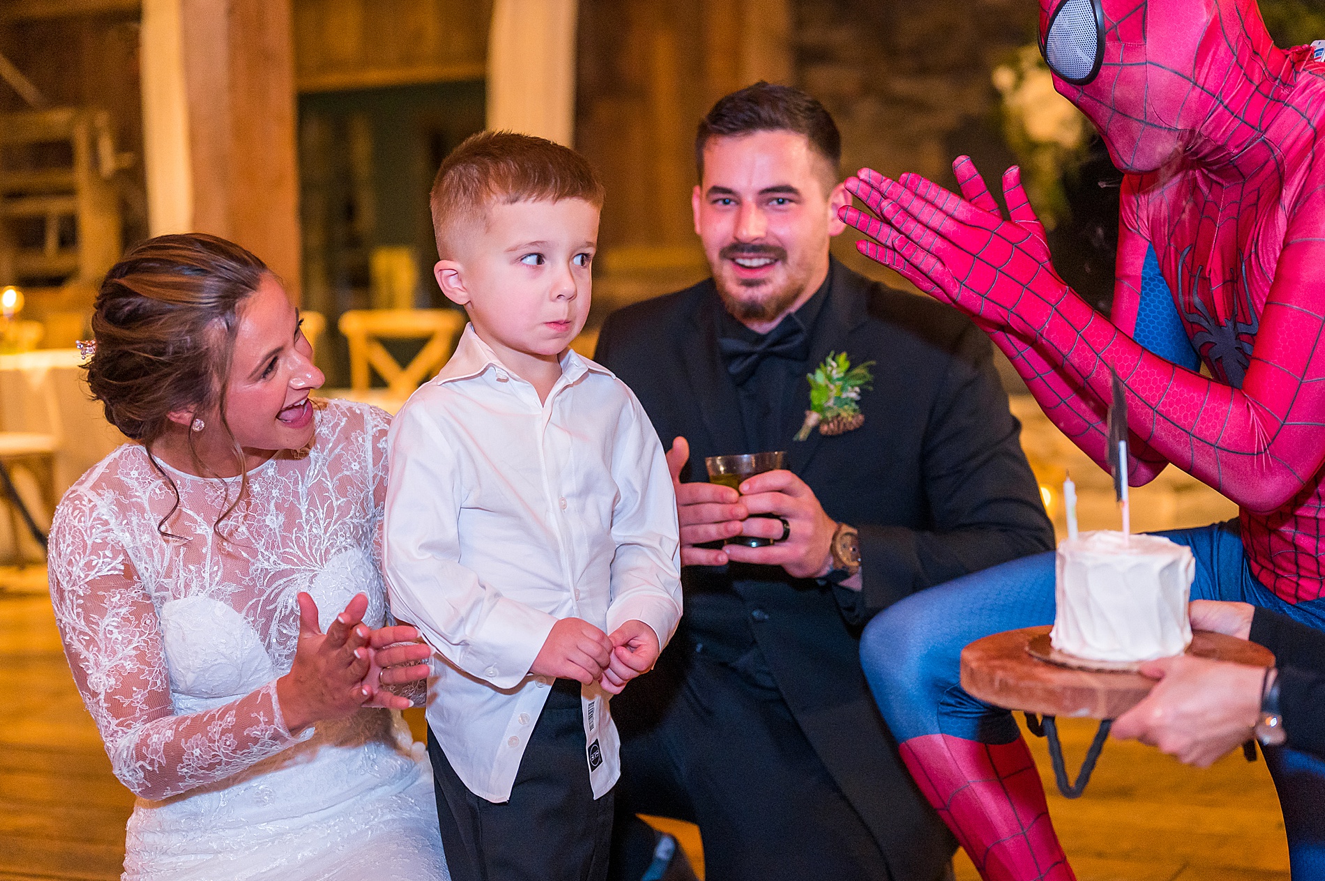 couple surprise nephew with Spiderman at wedding reception 