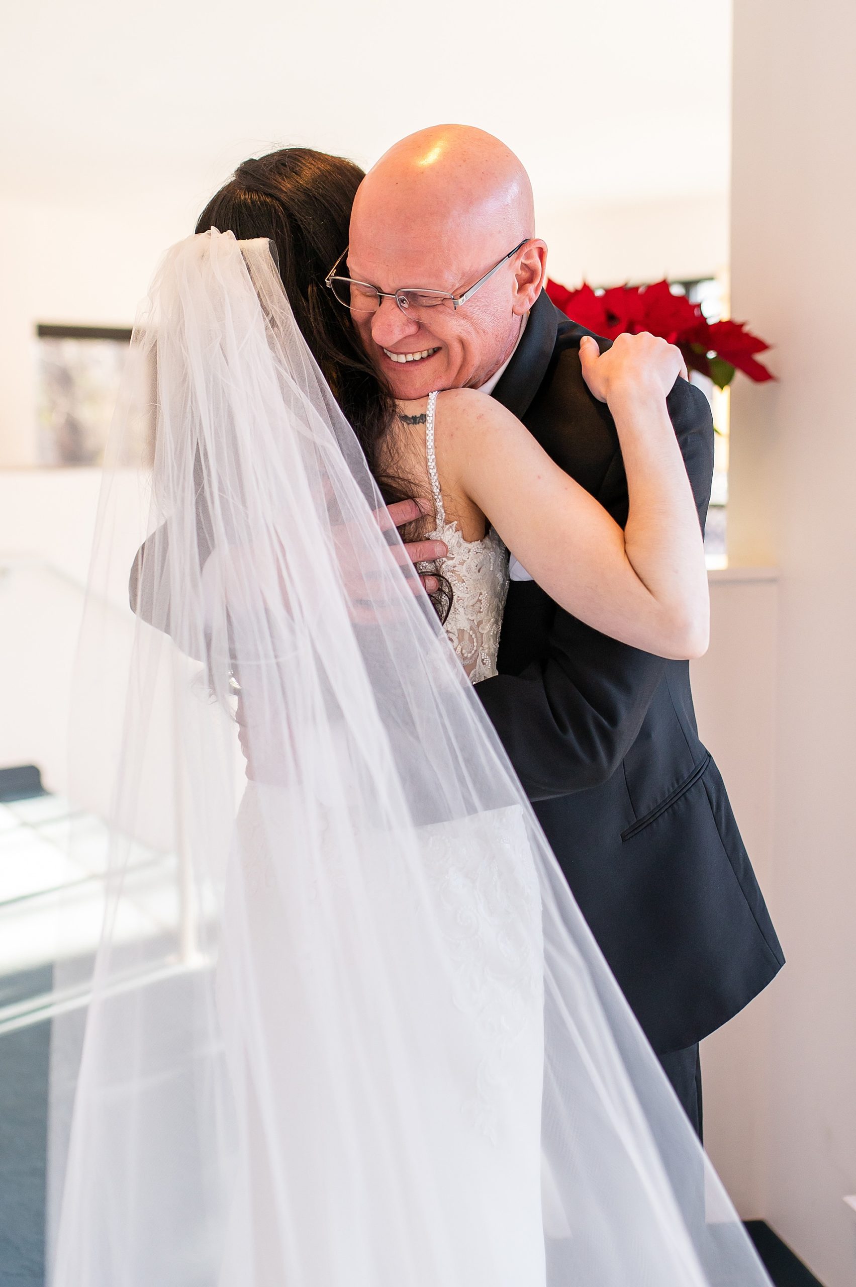 joyful and candid moment from first look between bride and father 