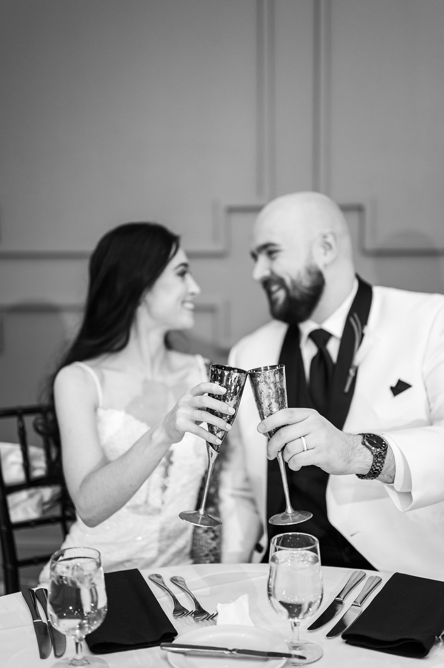 couple toast during wedding speeches